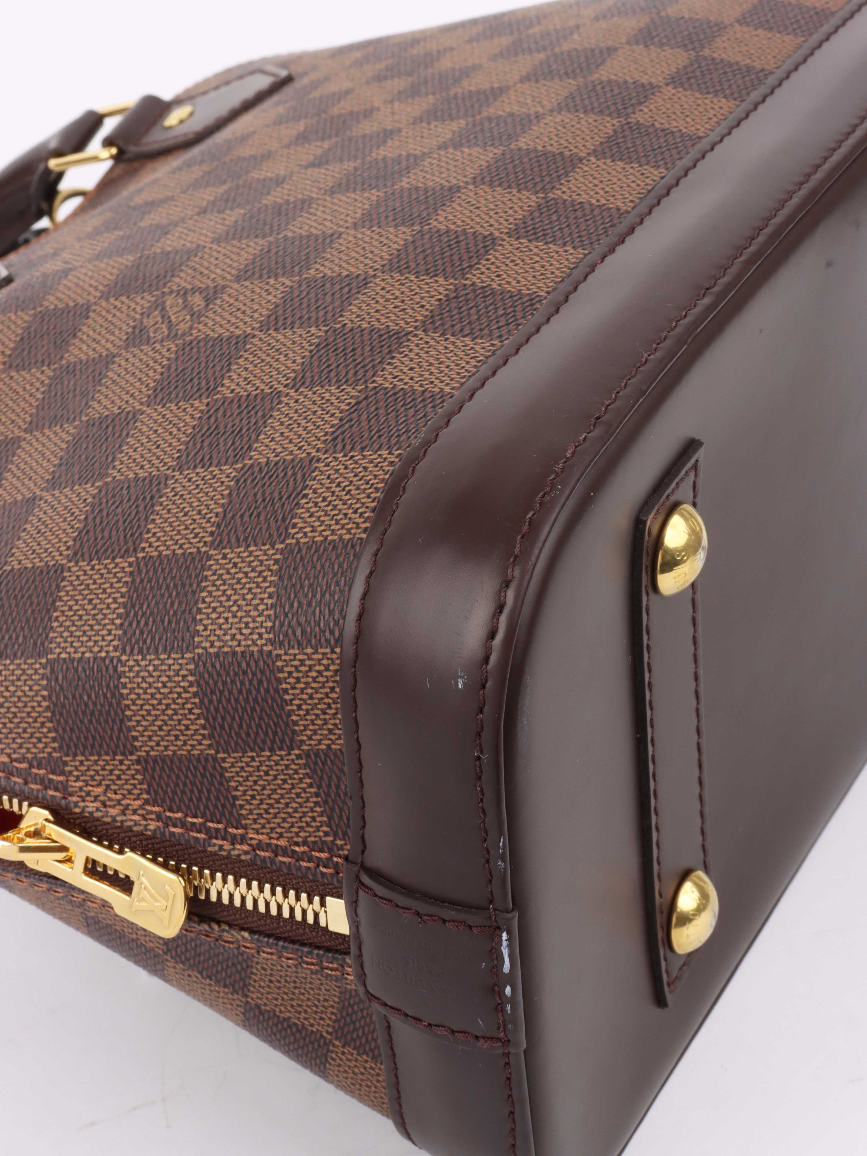 Louis Vuitton Damier Ebene Alma PM.