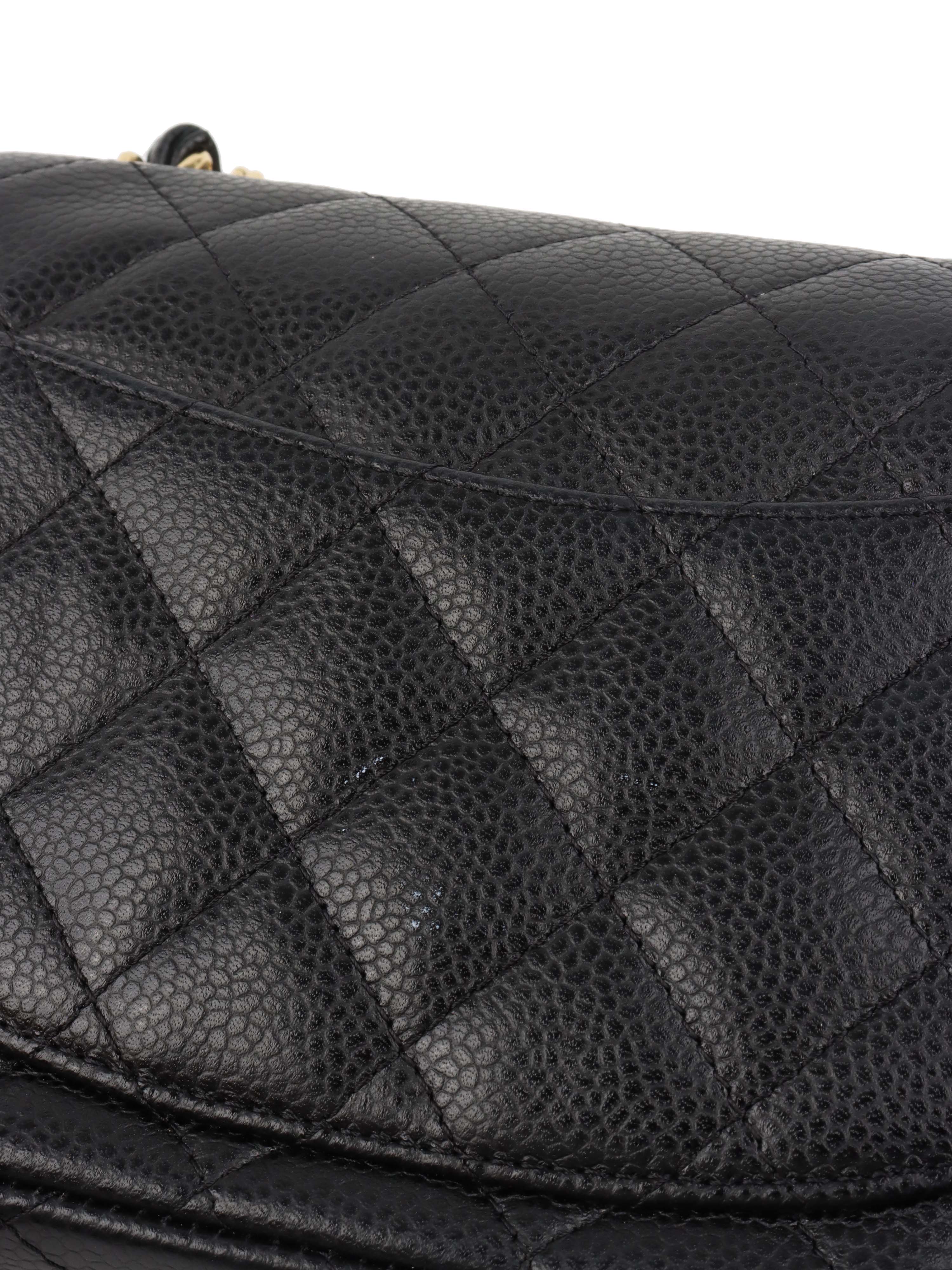 Chanel Black Mini Caviar Square Flap Bag.