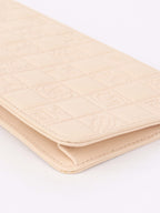 Chanel Beige Lucky Embossed Symbols Pochette with Wristlet Chain.