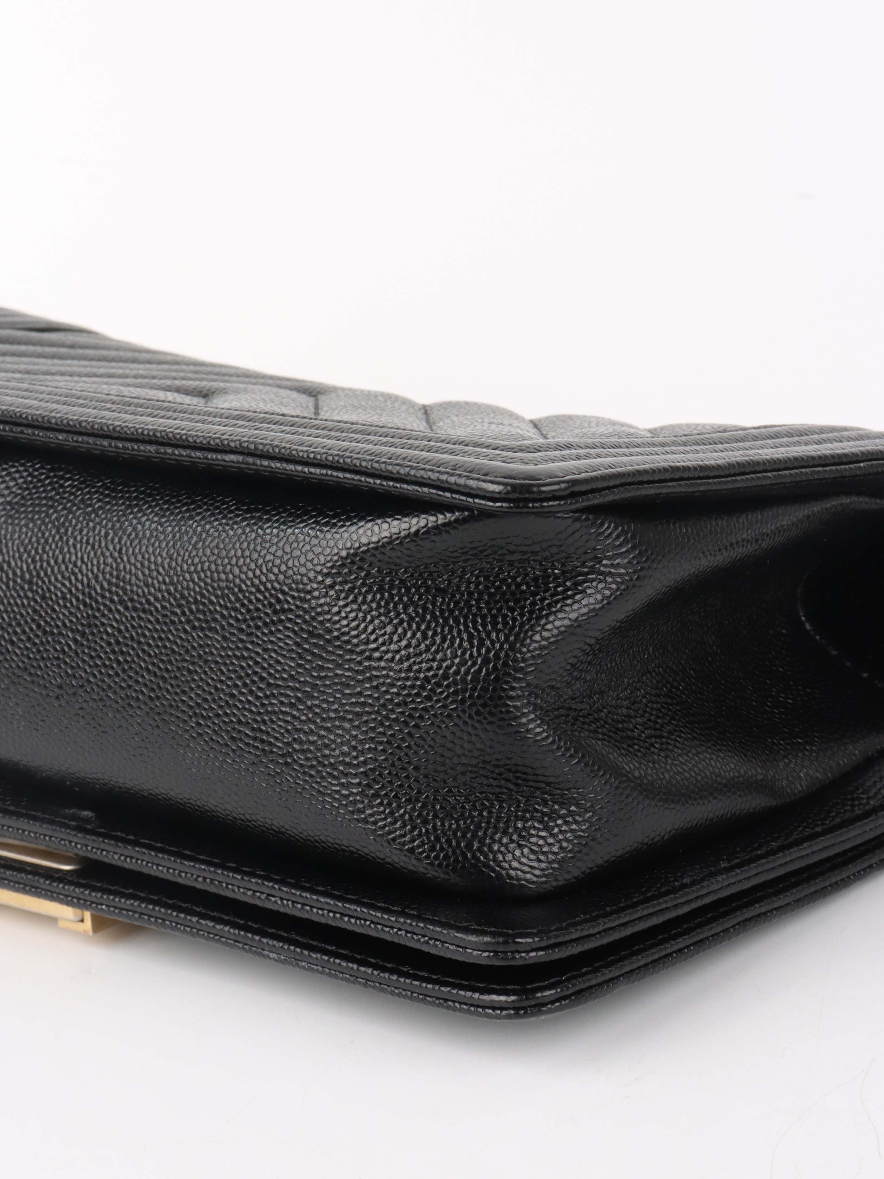 Chanel Black Chevron Caviar Medium Boy Bag.