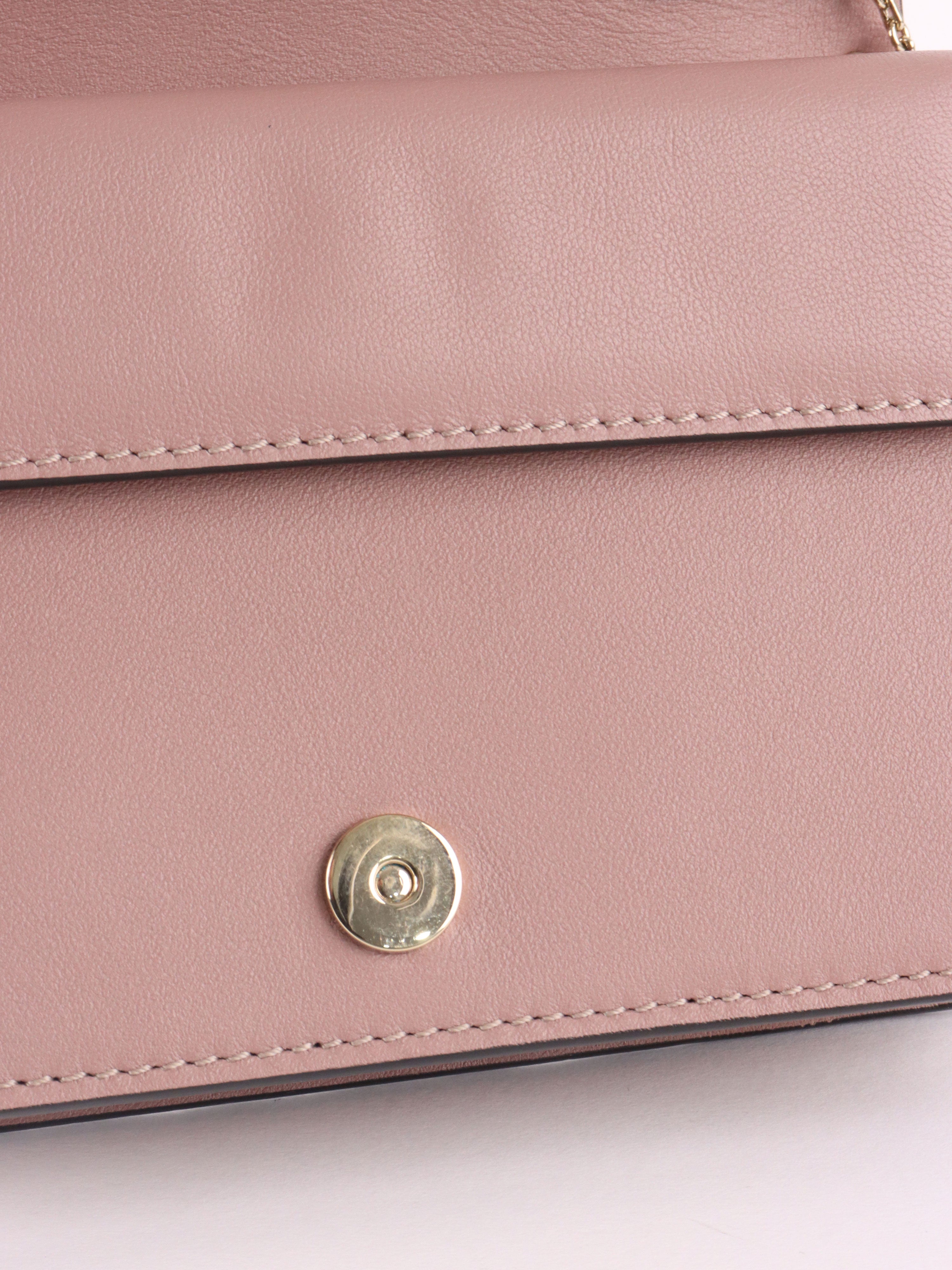 Valentino Garavani Pink Rockstud Cross Body Bag.