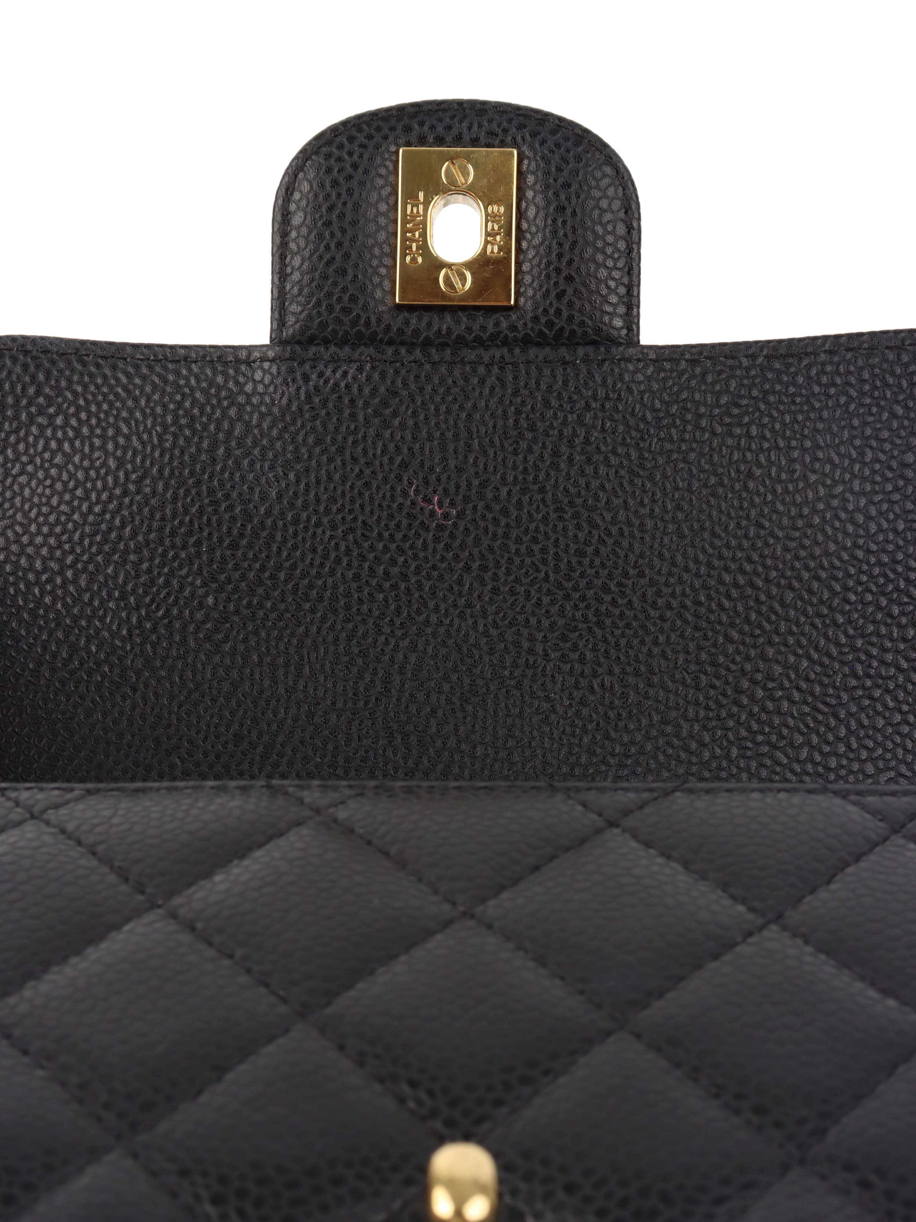 Chanel Black Mini Caviar Square Flap Bag.