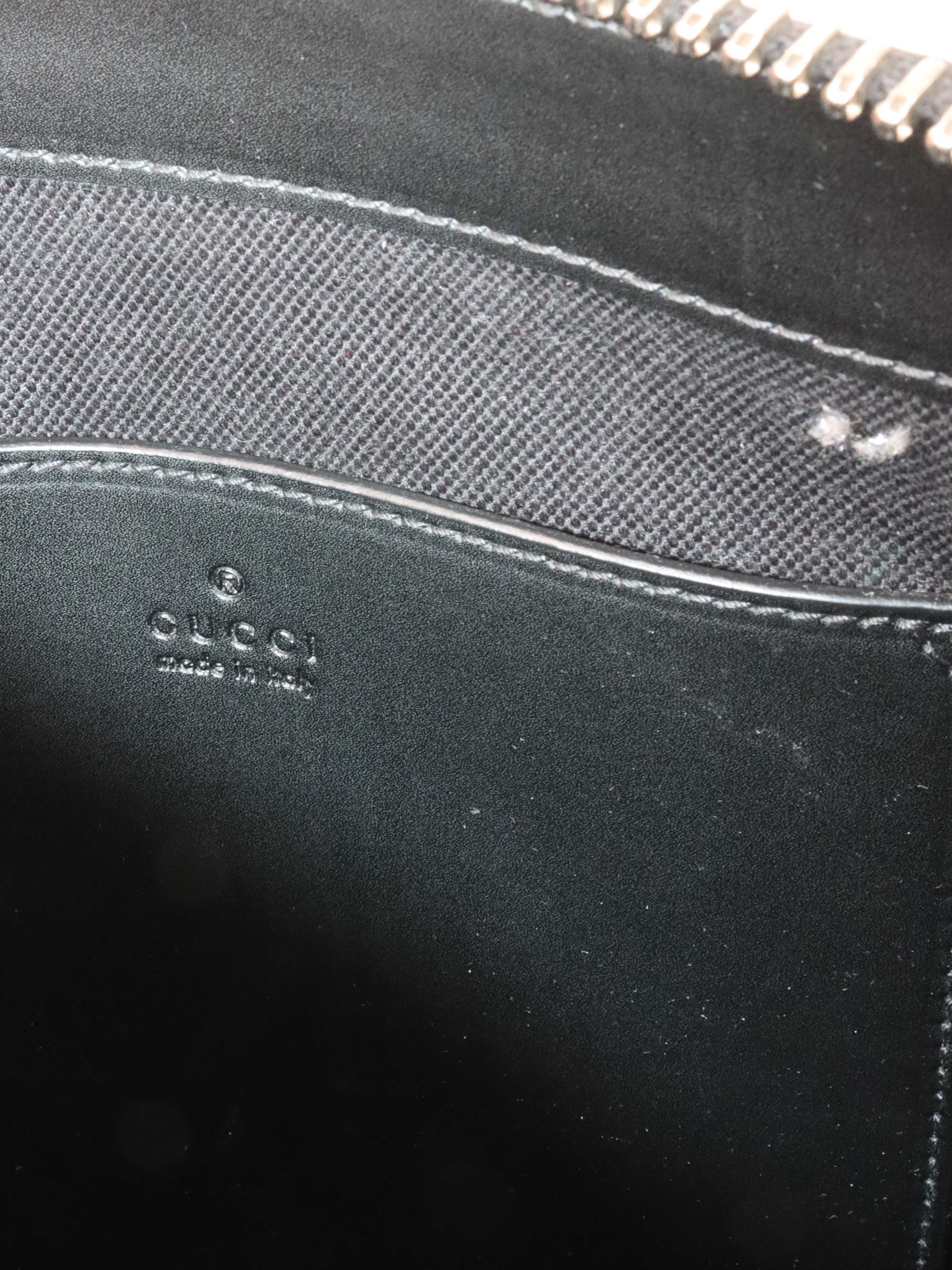 Gucci Black Monogram Messenger Bag.