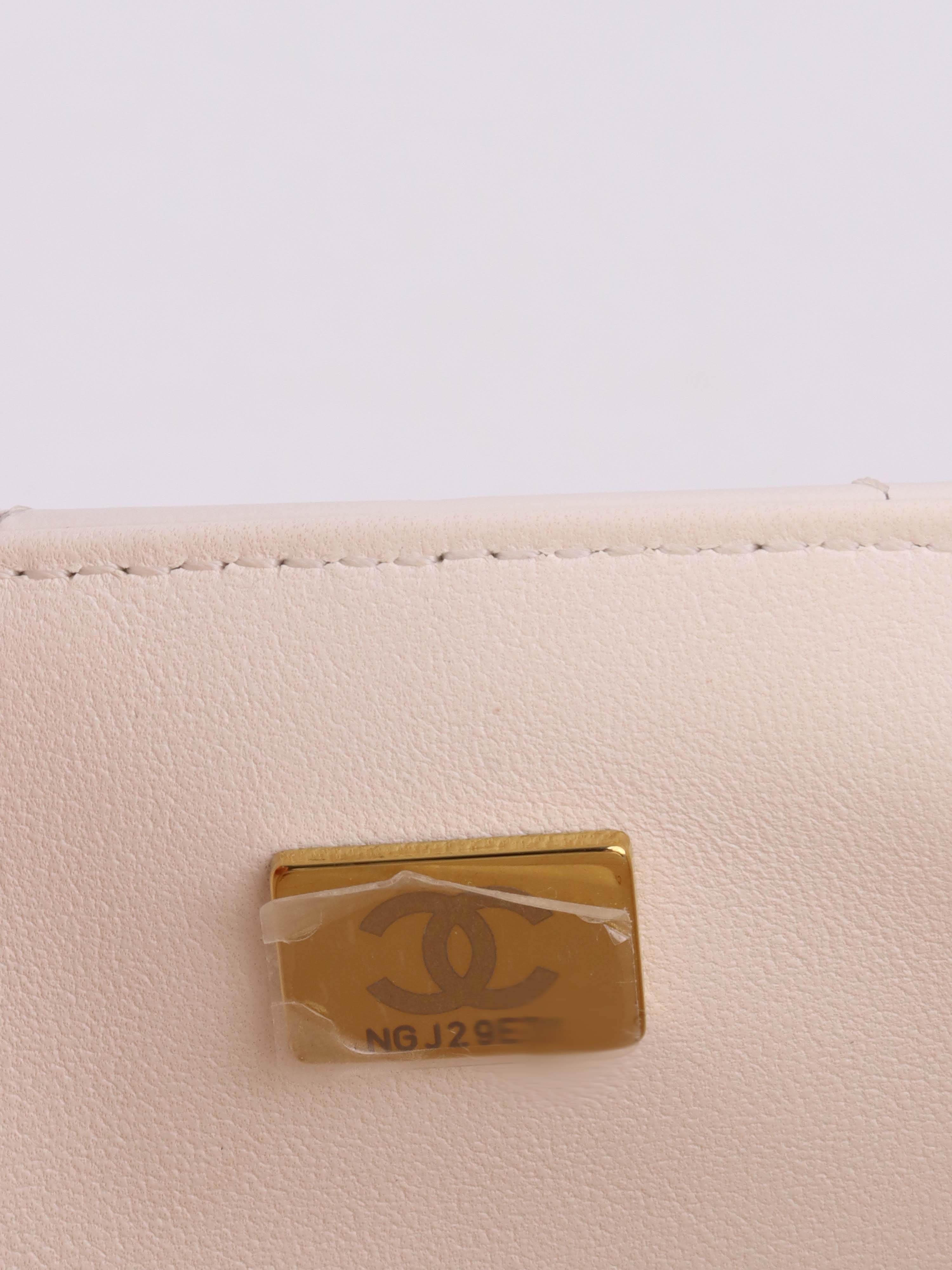 Chanel Small White Chevron 2.55 Bag.