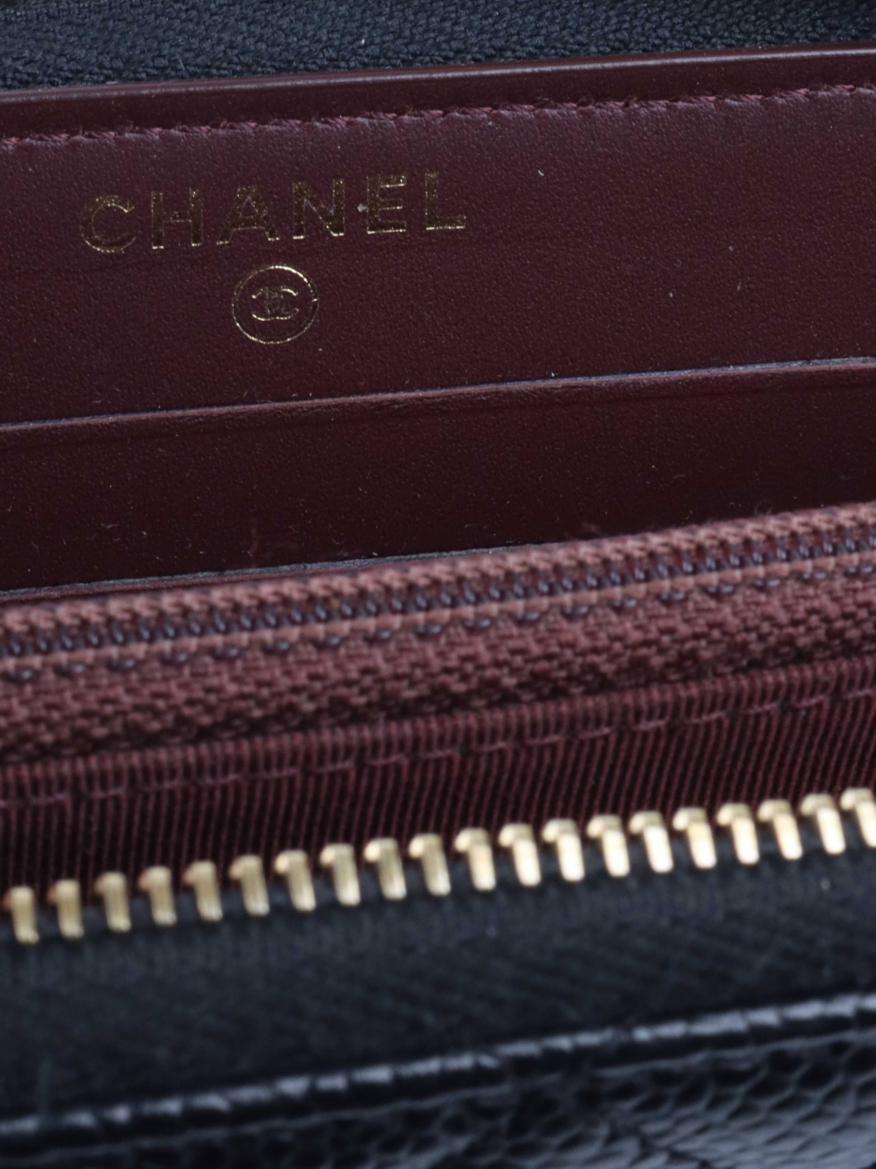 Chanel Zip Around Black Caviar Wallet.