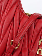 Miu Miu Small Red Wander Matelassé Bag.