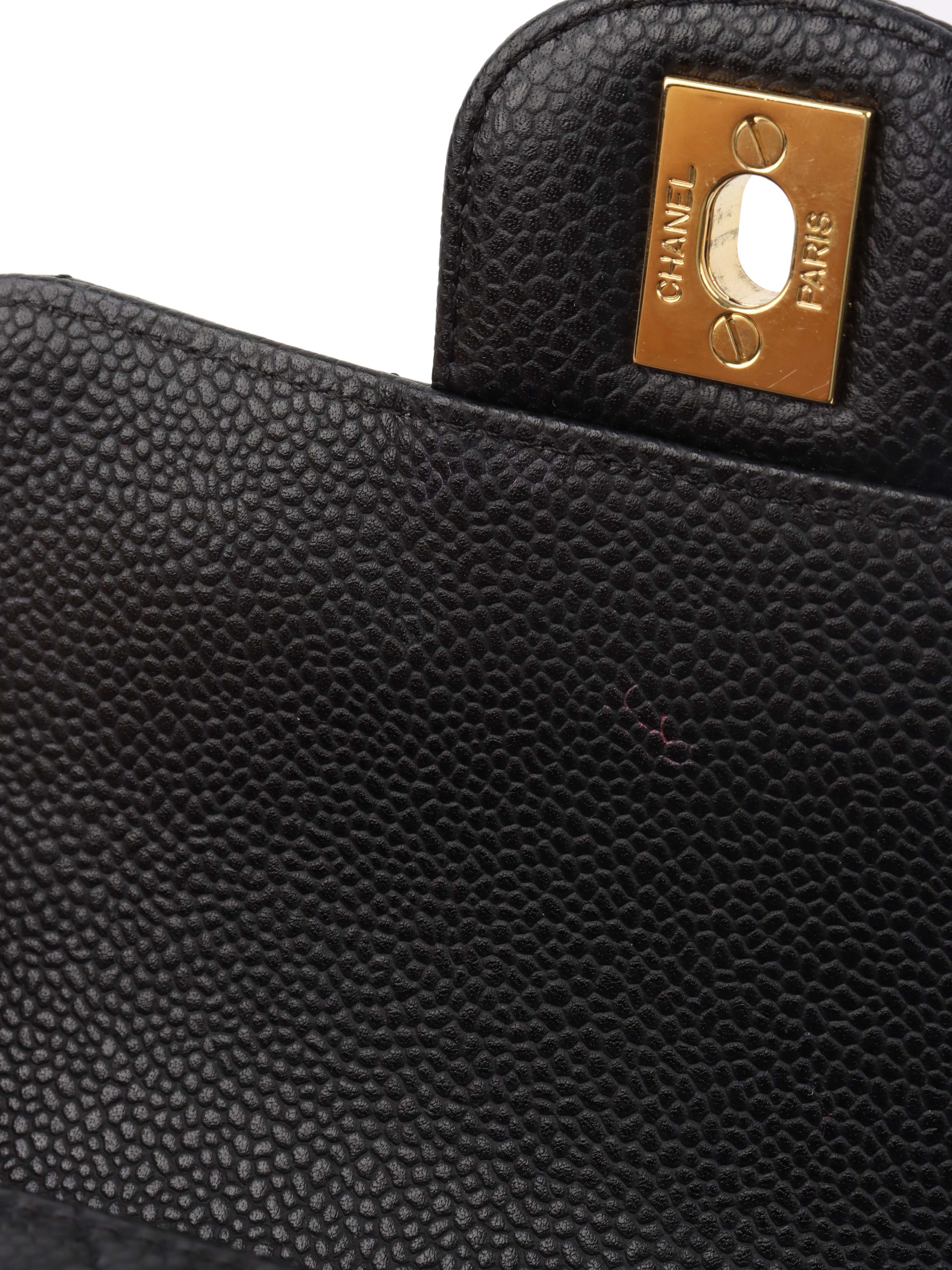 Chanel Black Mini Caviar Square Flap Bag.