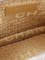 Chanel Beige Lucky Embossed Symbols Pochette with Wristlet Chain.