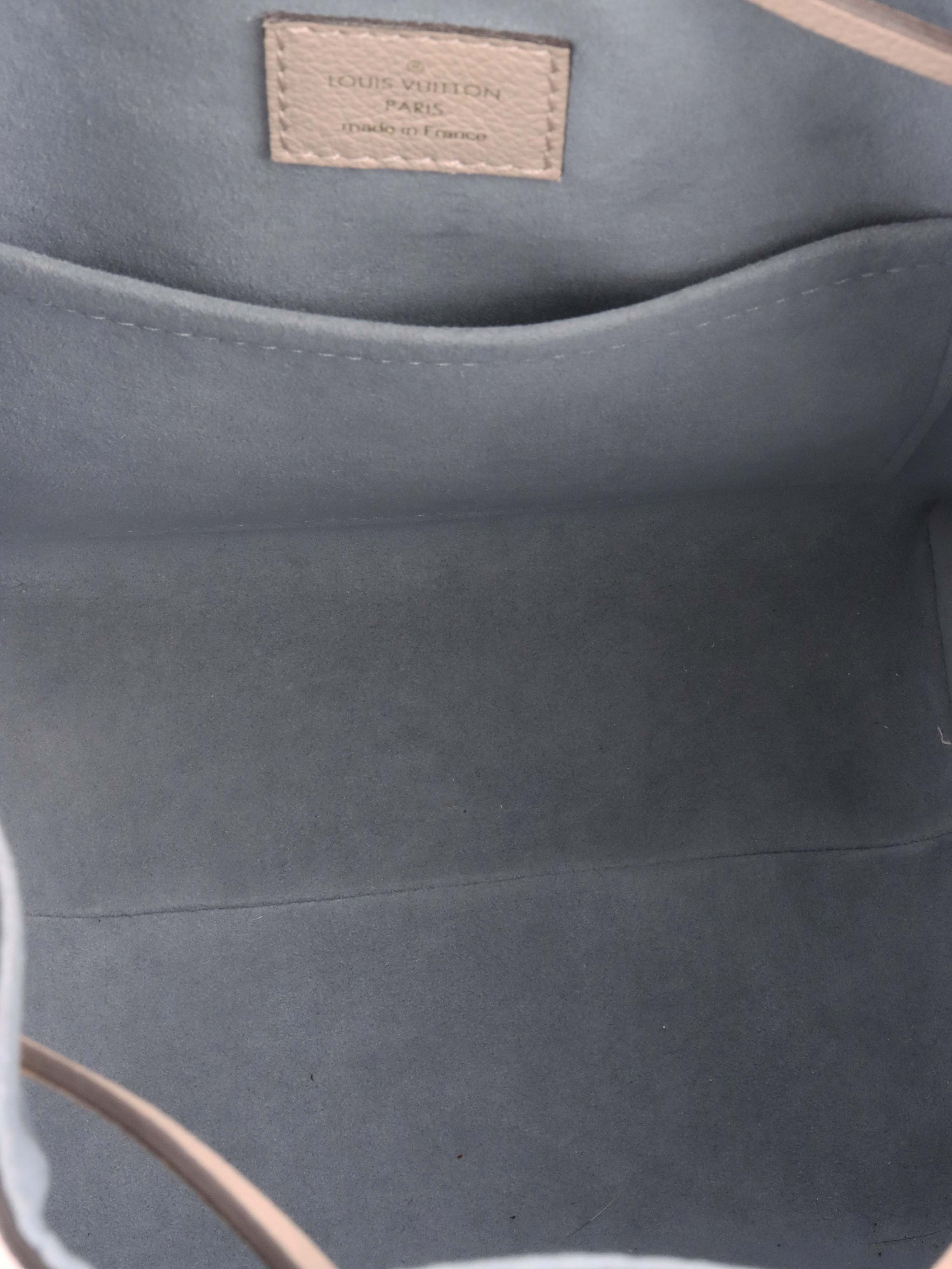 Louis Vuitton Beige Lockme Bucket Bag.