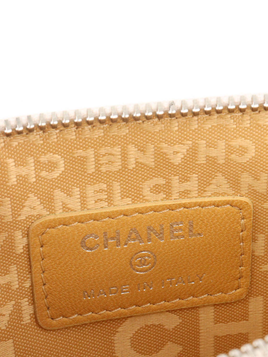Chanel Beige Lucky Embossed Symbols Pochette with Wristlet Chain.