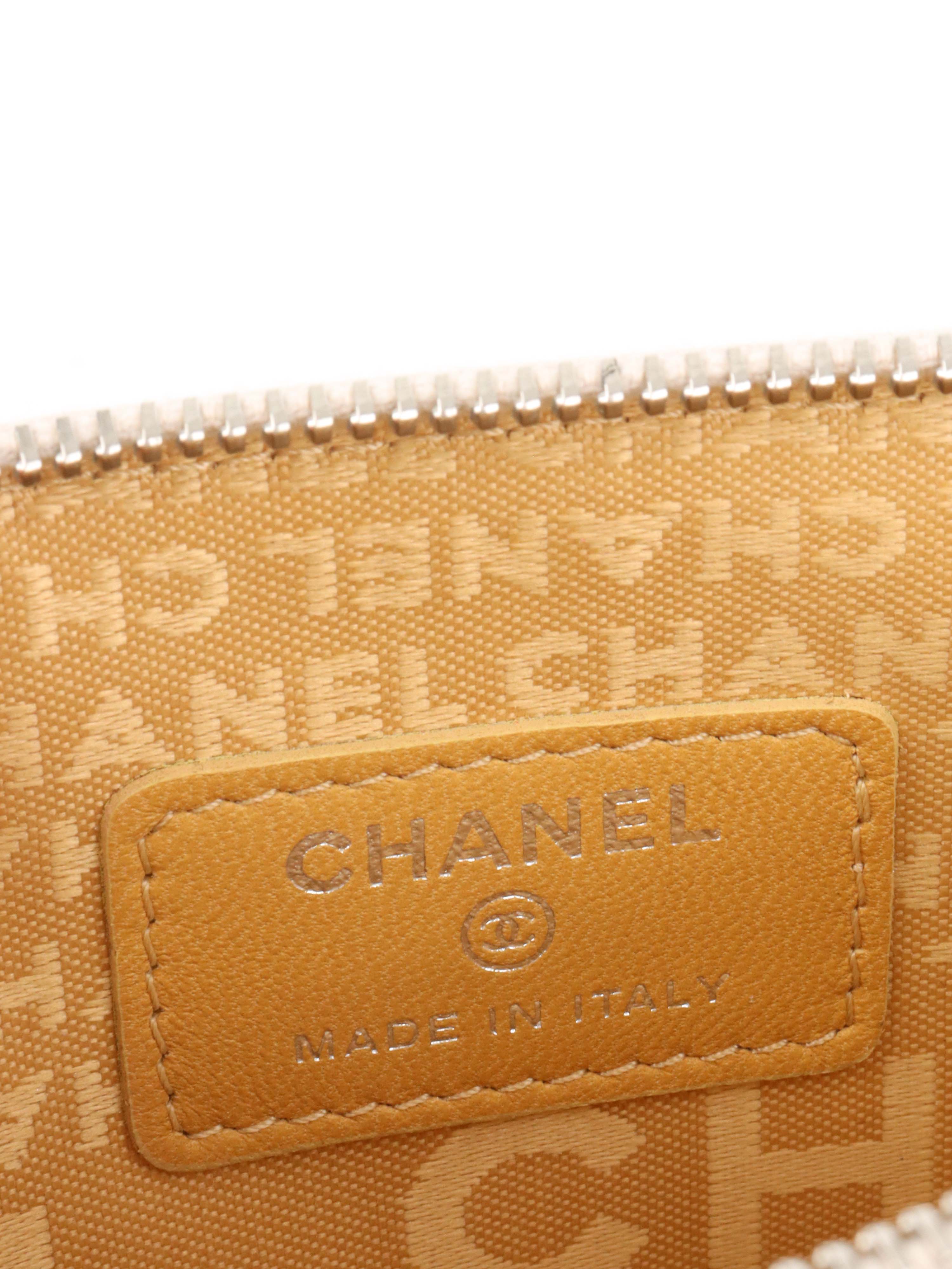 Chanel Beige Lucky Embossed Symbols Pochette with Wristlet Chain.