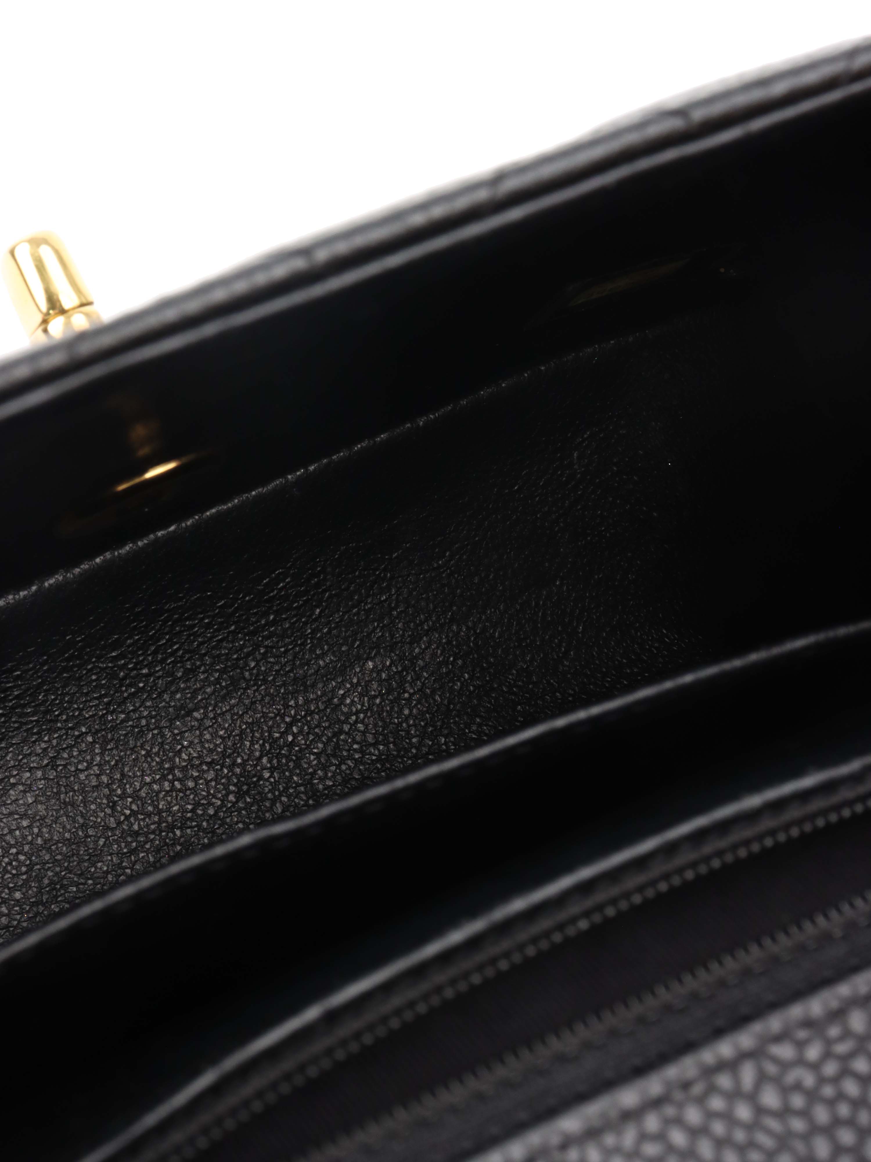 Chanel Black Mini Caviar Square Flap Bag.