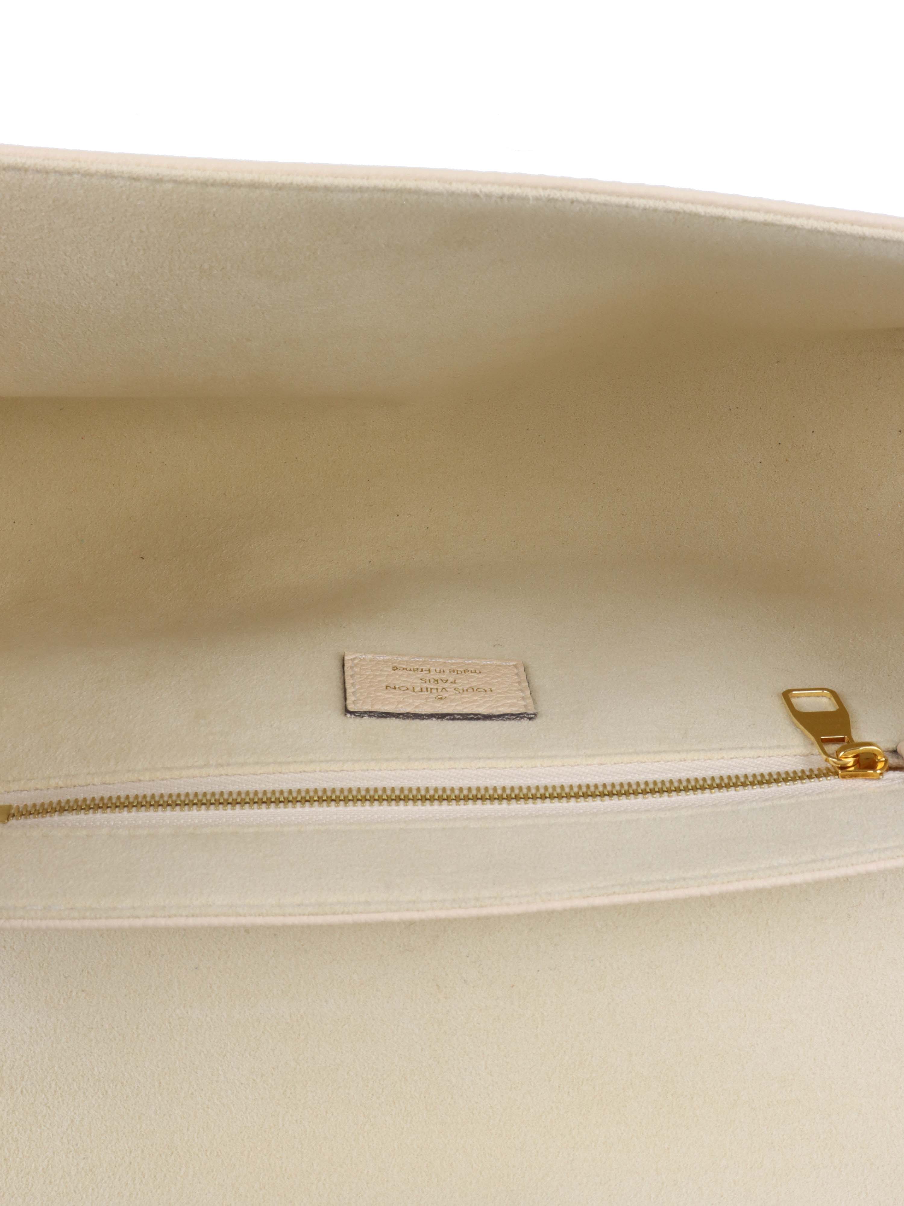 Louis Vuitton Cream Monogram Empreinte Saint Germain PM Bag.