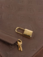 Louis Vuitton Terre Empreinte Monogram Audacieuse PM Bag.