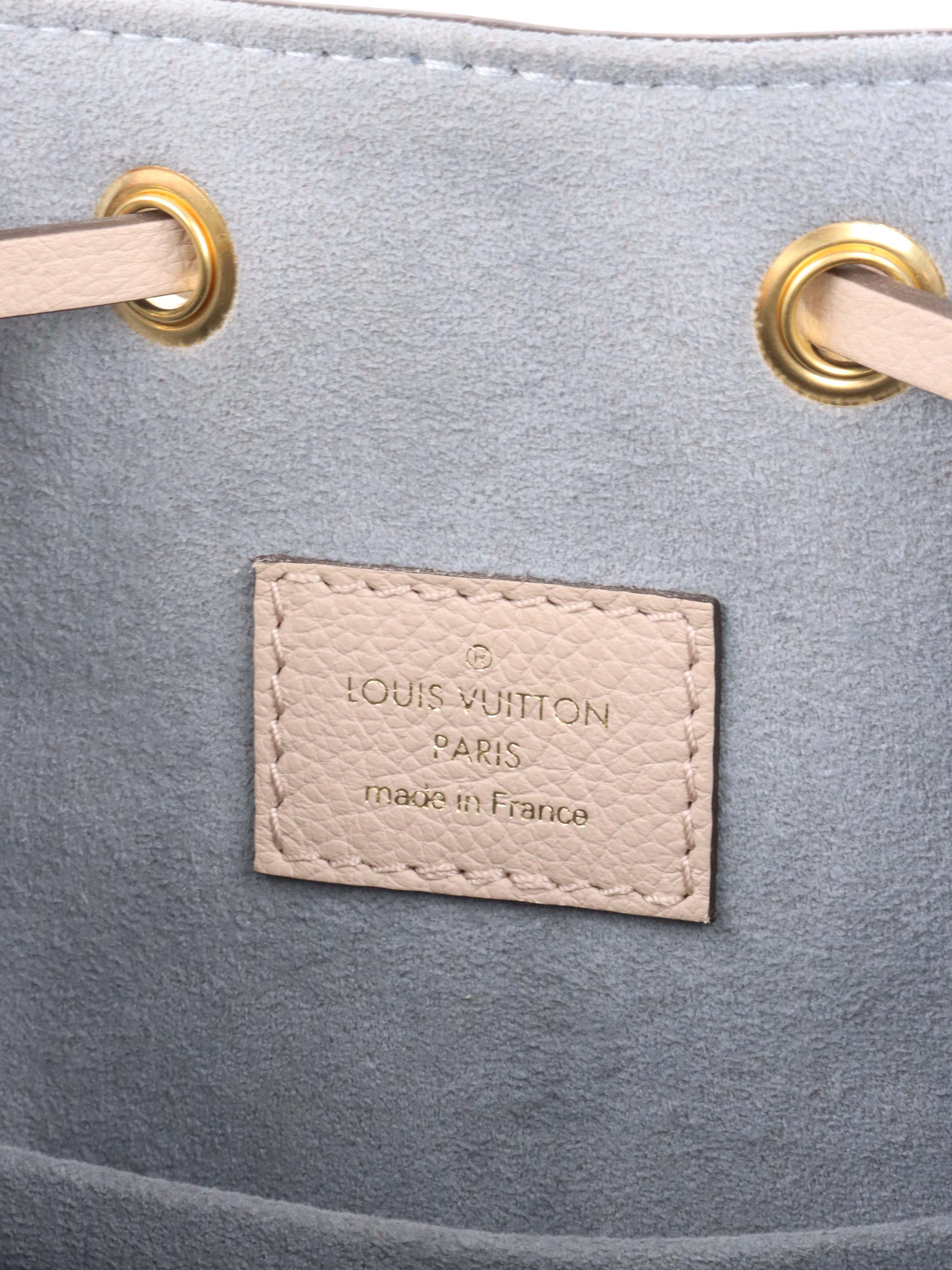 Louis Vuitton Beige Lockme Bucket Bag.