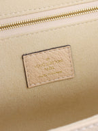 Louis Vuitton Cream Monogram Empreinte Saint Germain PM Bag.