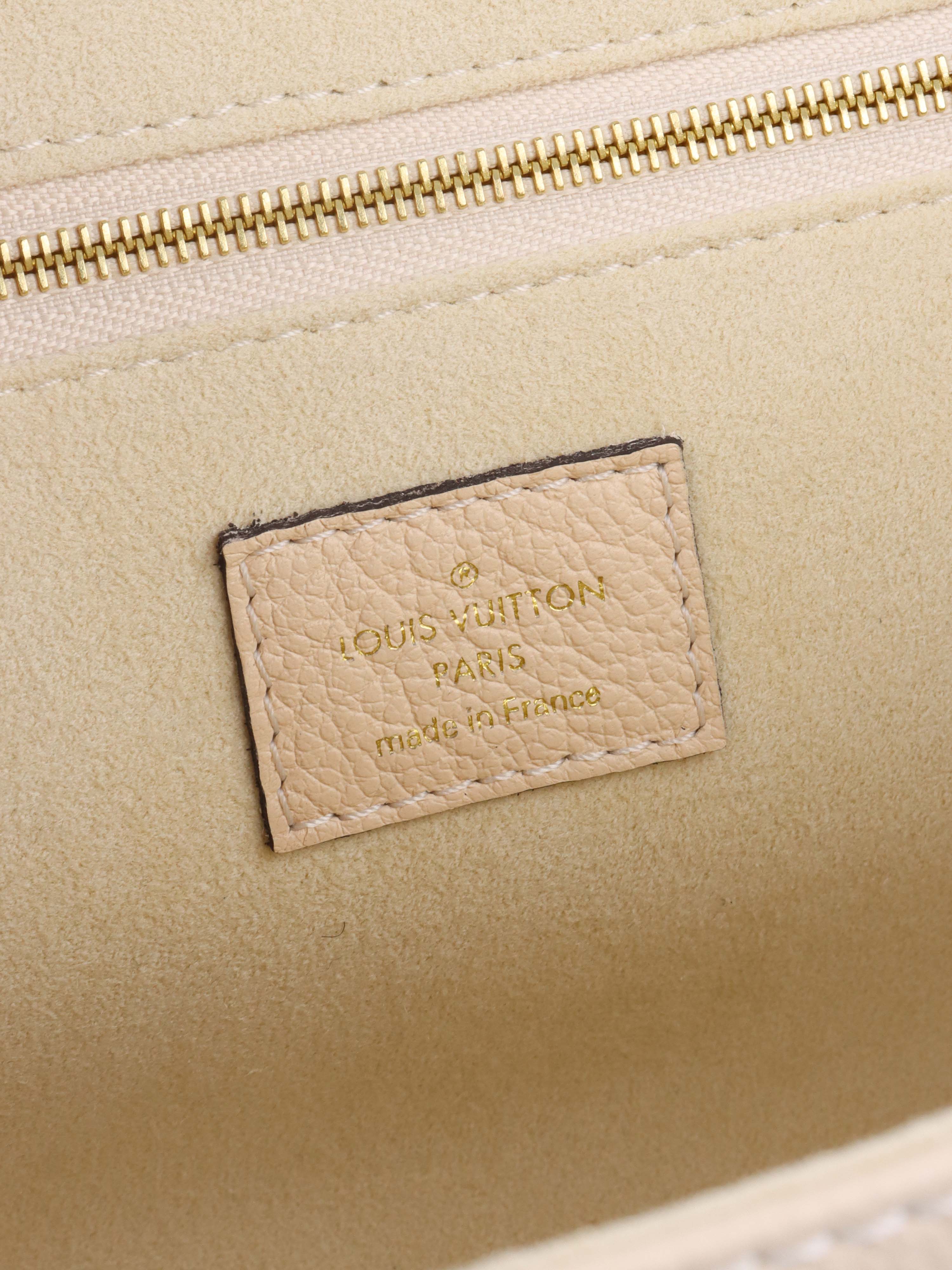 Louis Vuitton Cream Monogram Empreinte Saint Germain PM Bag.