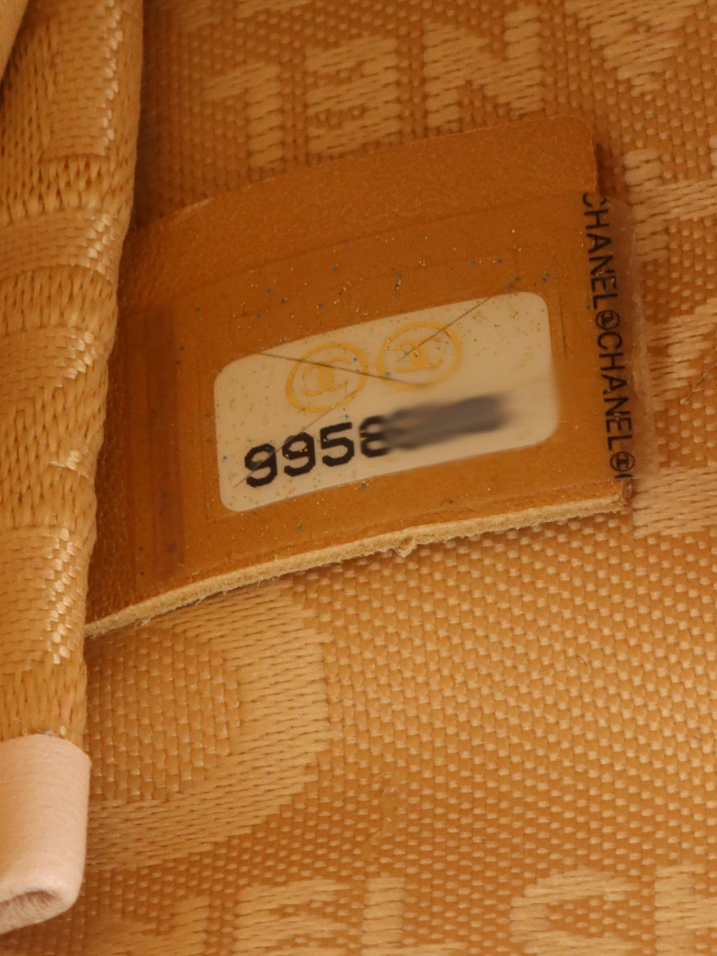 Chanel Beige Lucky Embossed Symbols Pochette with Wristlet Chain.