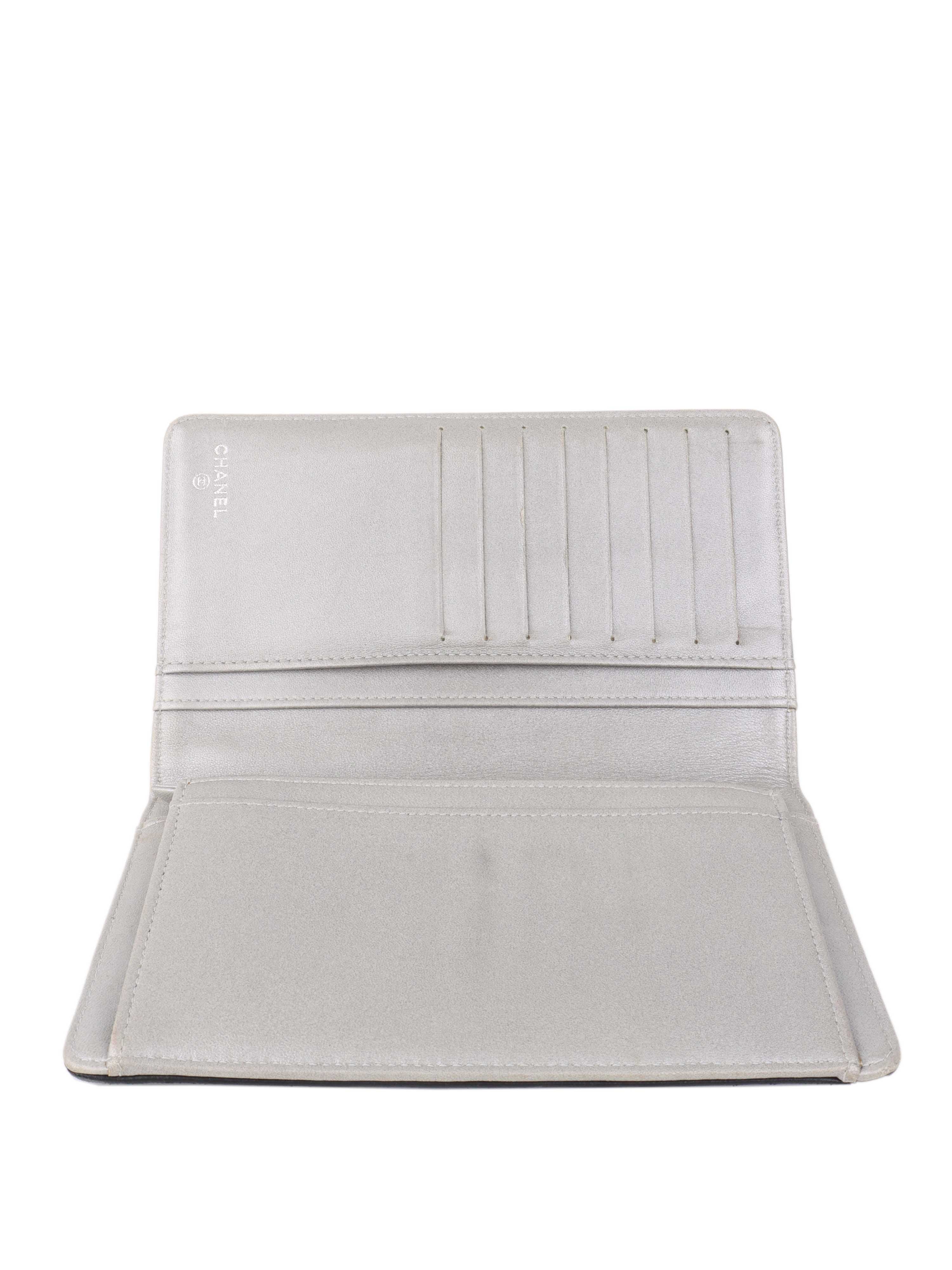 Chanel Black Camellia Wallet.