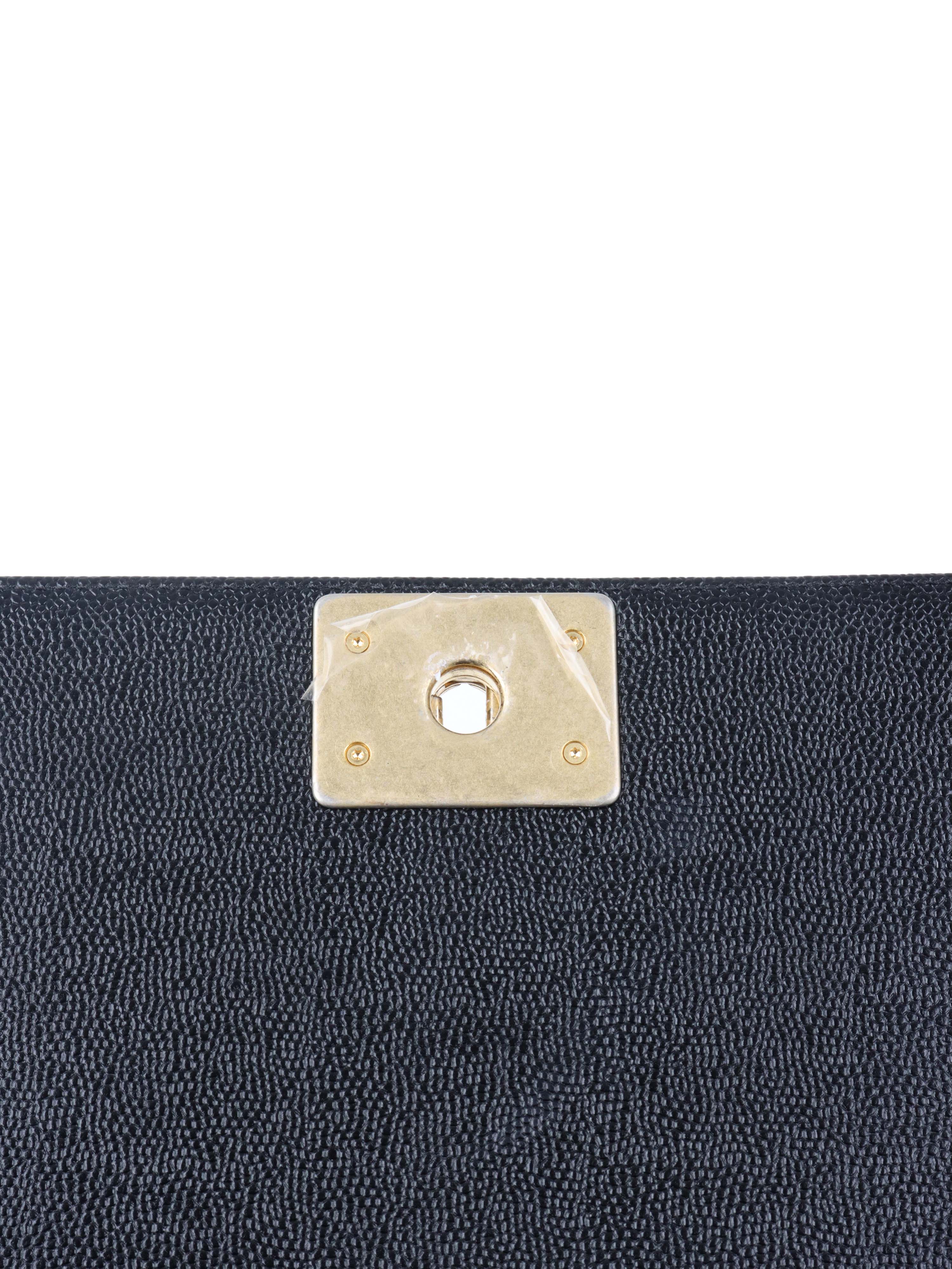 Chanel Black Chevron Caviar Medium Boy Bag.