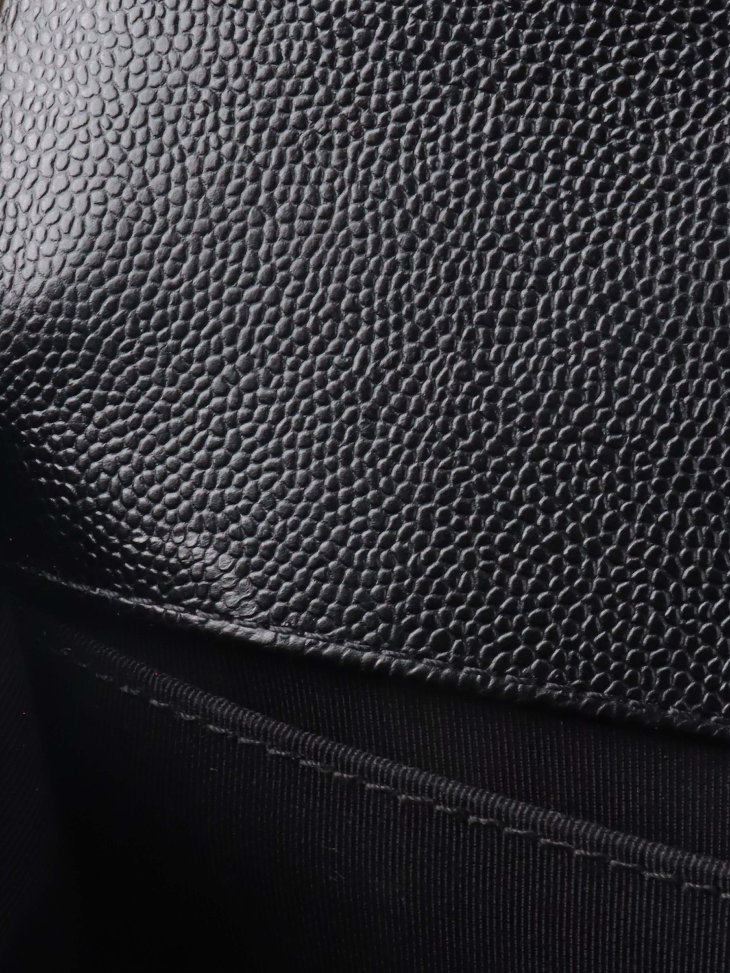 Chanel Black Chevron Caviar Medium Boy Bag.