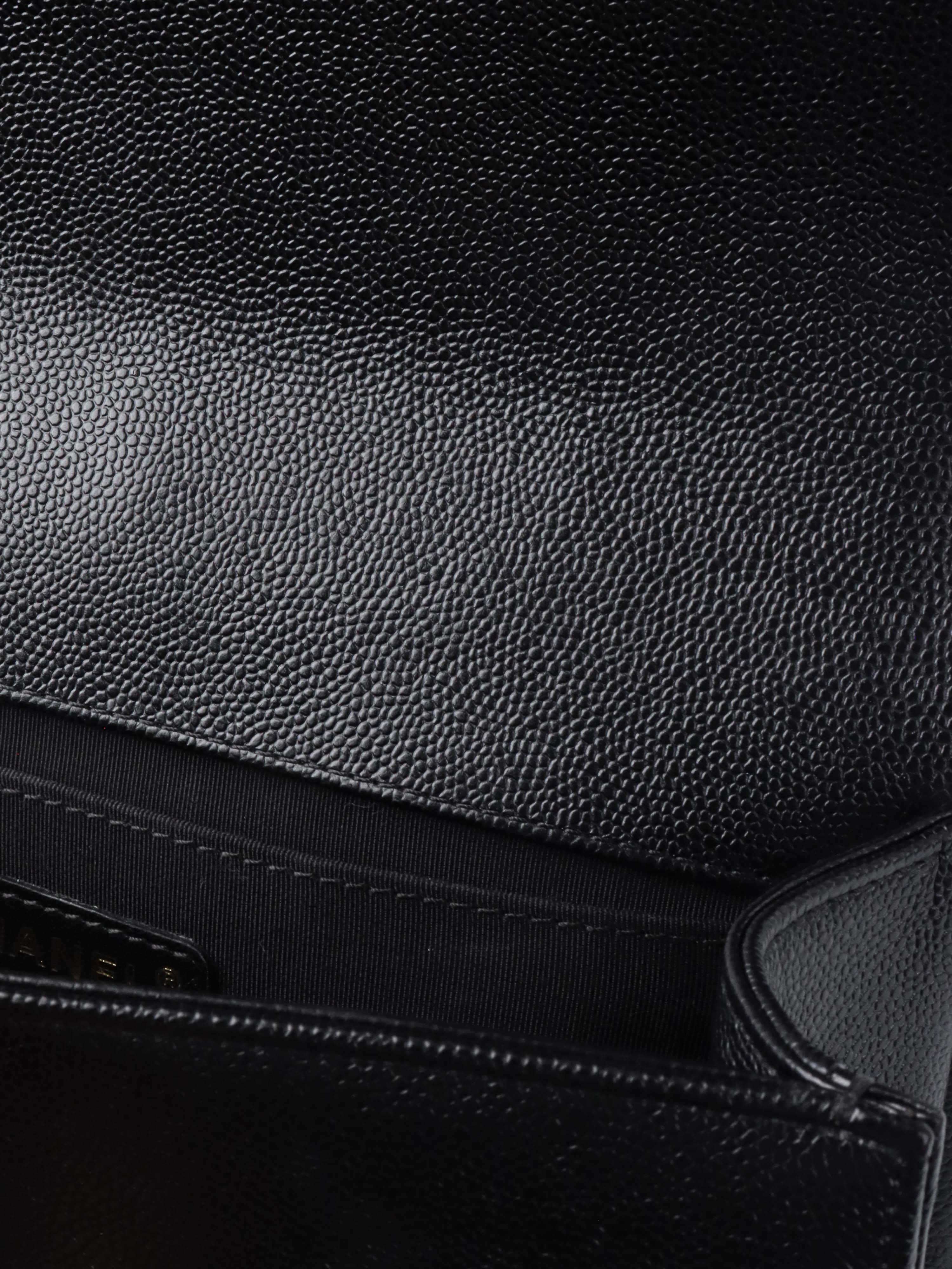 Chanel Black Chevron Caviar Medium Boy Bag.