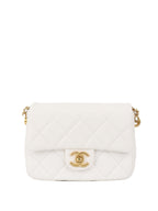 Chanel White and Pearl Chain Flap Bag.