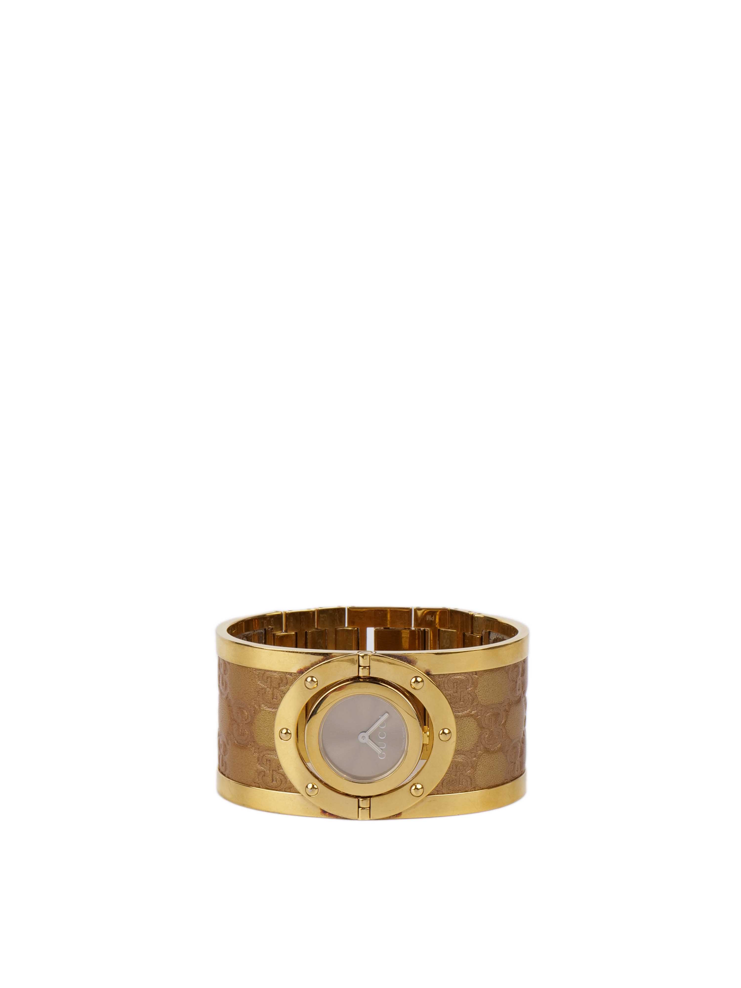 Gucci Twirl Reversible Gold Bracelet Watch.