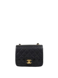 Chanel Black Mini Caviar Square Flap Bag.