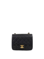 Chanel Black Mini Caviar Square Flap Bag.
