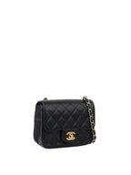 Chanel Black Mini Caviar Square Flap Bag.