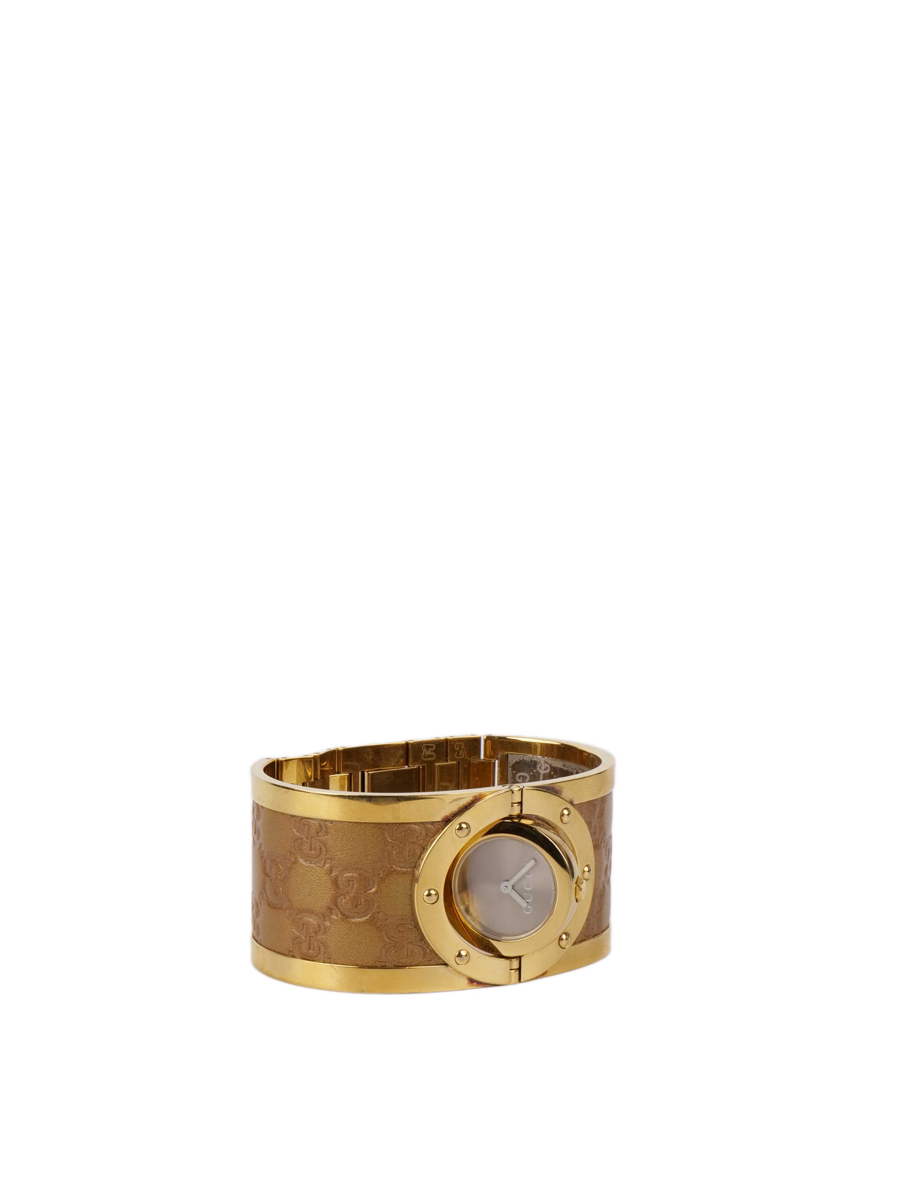 Gucci Twirl Reversible Gold Bracelet Watch.
