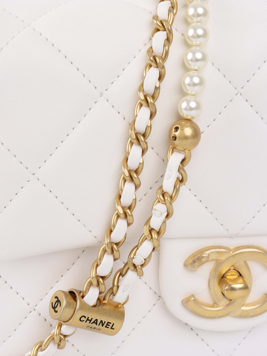 Chanel White and Pearl Chain Flap Bag.