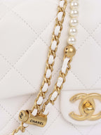 Chanel White and Pearl Chain Flap Bag.