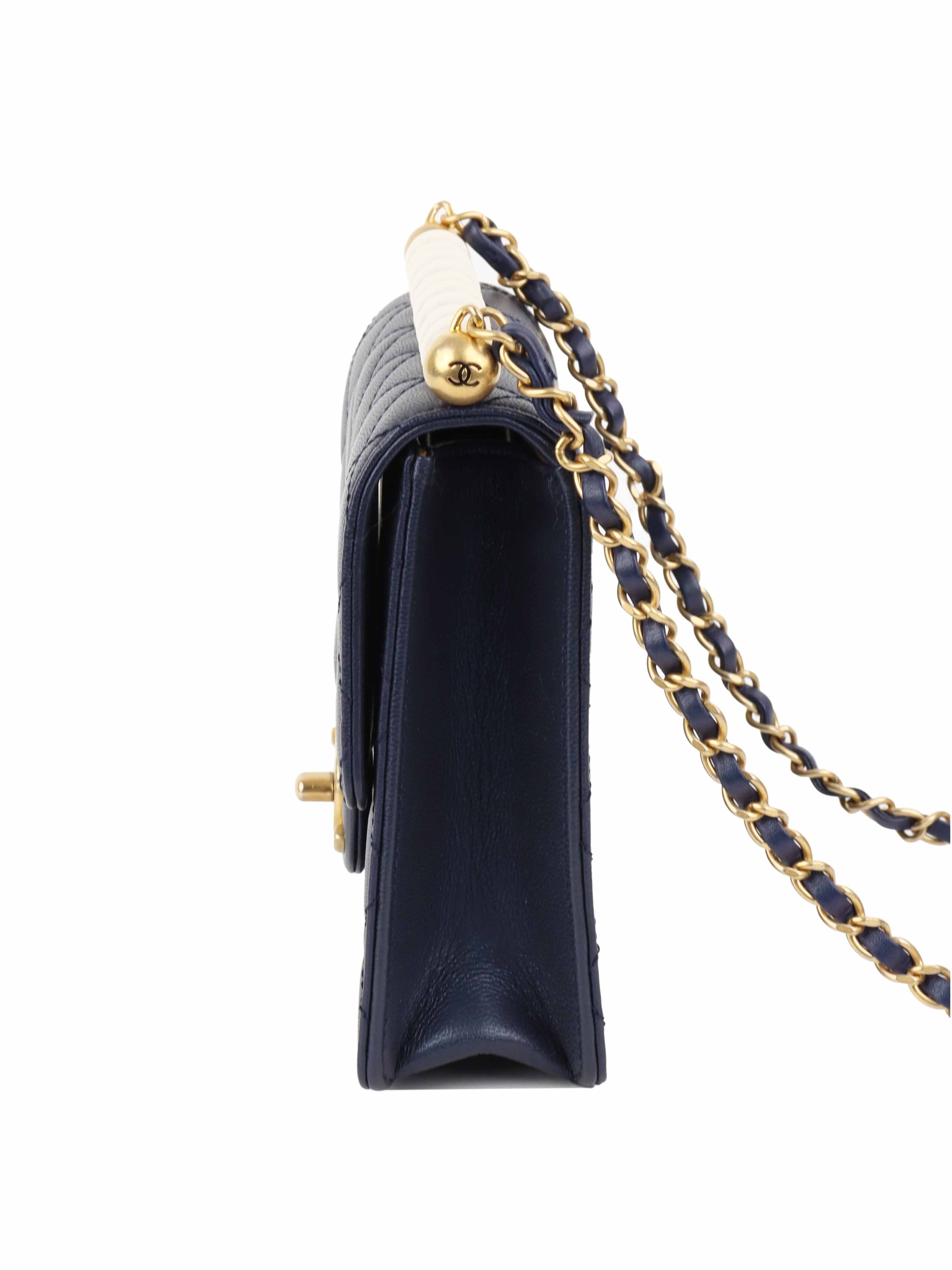 Chanel Navy Iridescent Flap Bag with Pearls.