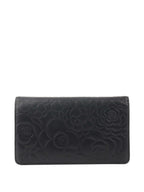 Chanel Black Camellia Wallet.
