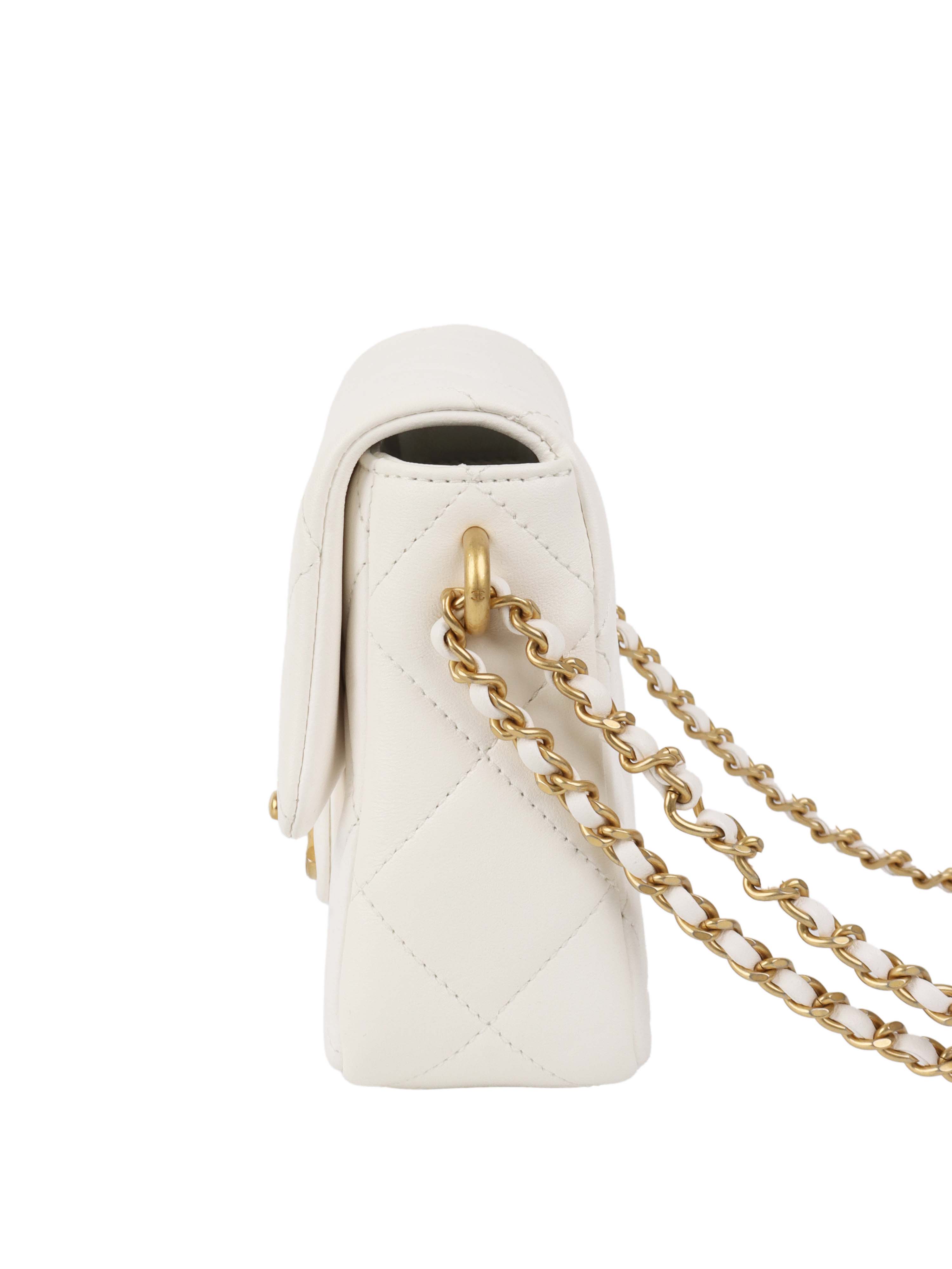 Chanel White and Pearl Chain Flap Bag.