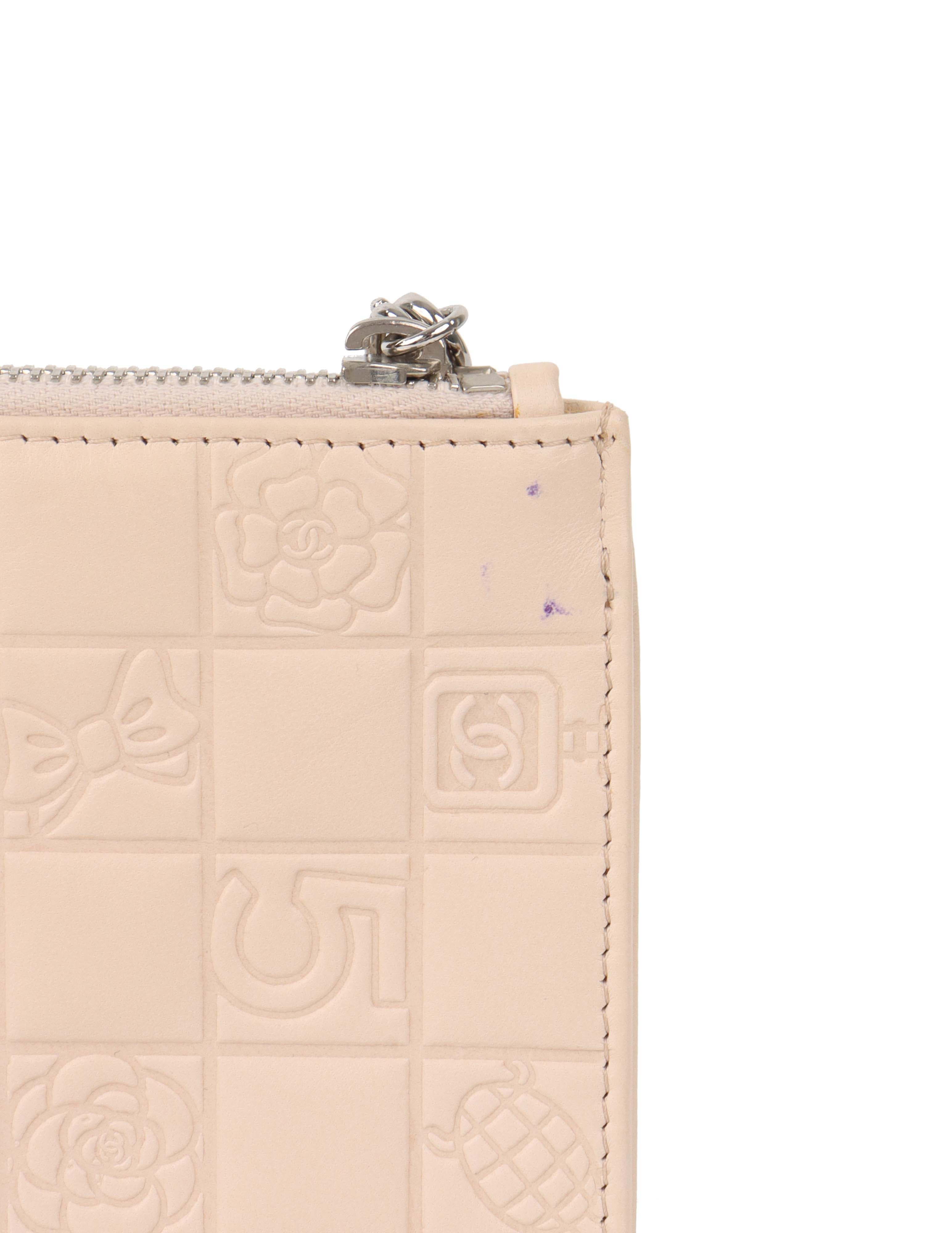 Chanel Beige Lucky Embossed Symbols Pochette with Wristlet Chain.