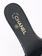 Chanel Black Camellia Slide Sandals.
