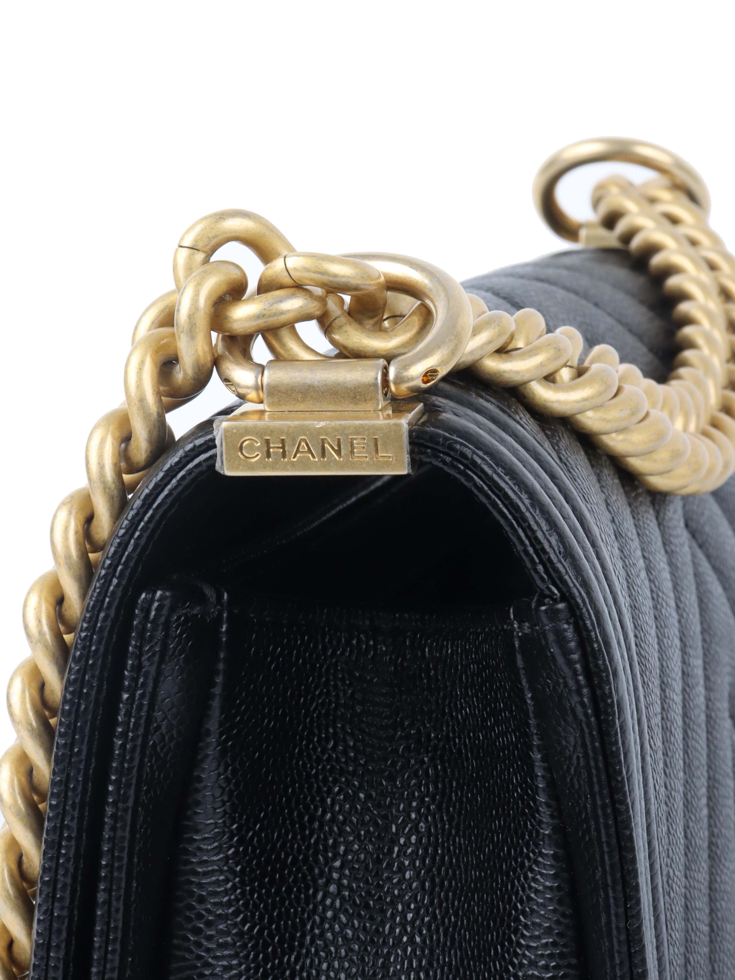 Chanel Black Chevron Caviar Medium Boy Bag.