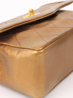 Chanel Gold Matellic Vintage Chain Bag.