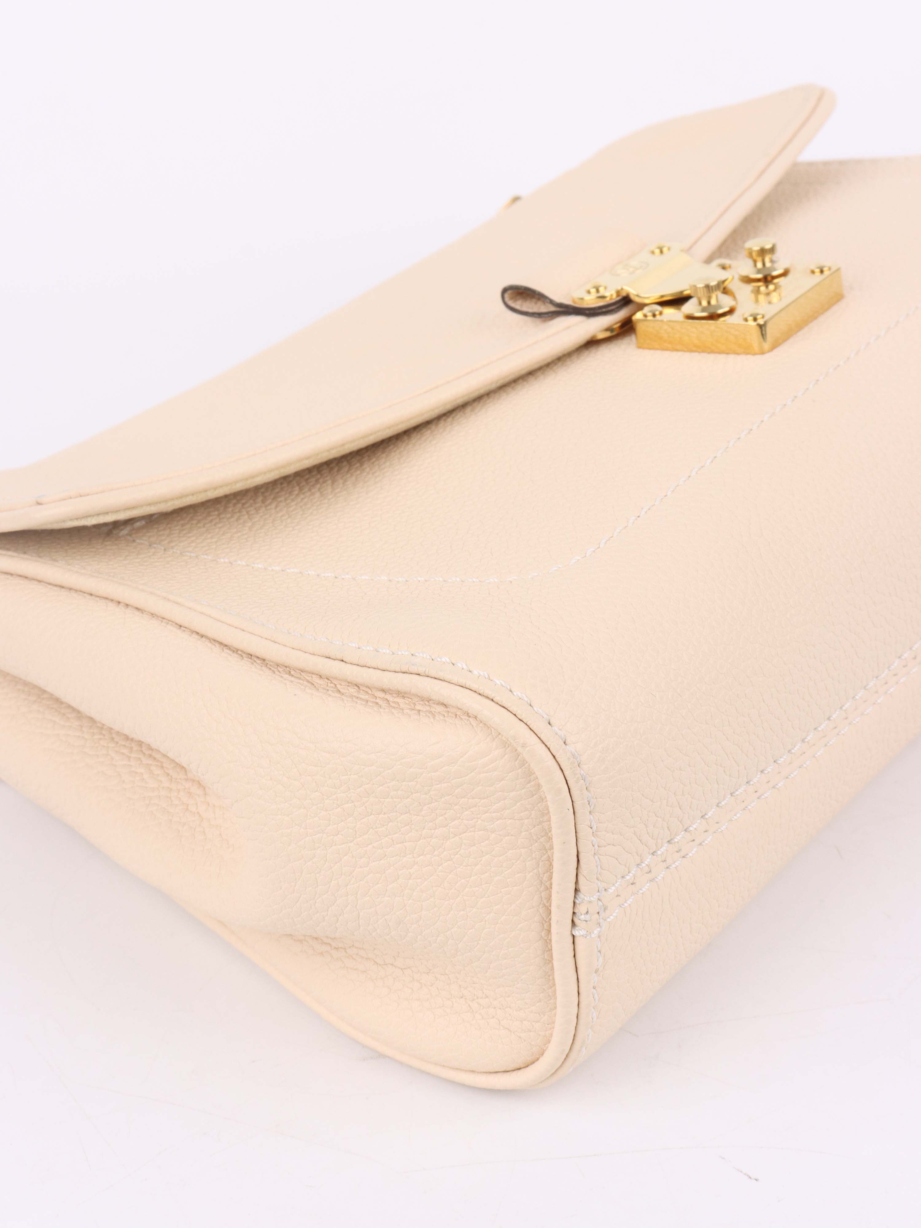 Louis Vuitton Cream Monogram Empreinte Saint Germain PM Bag.