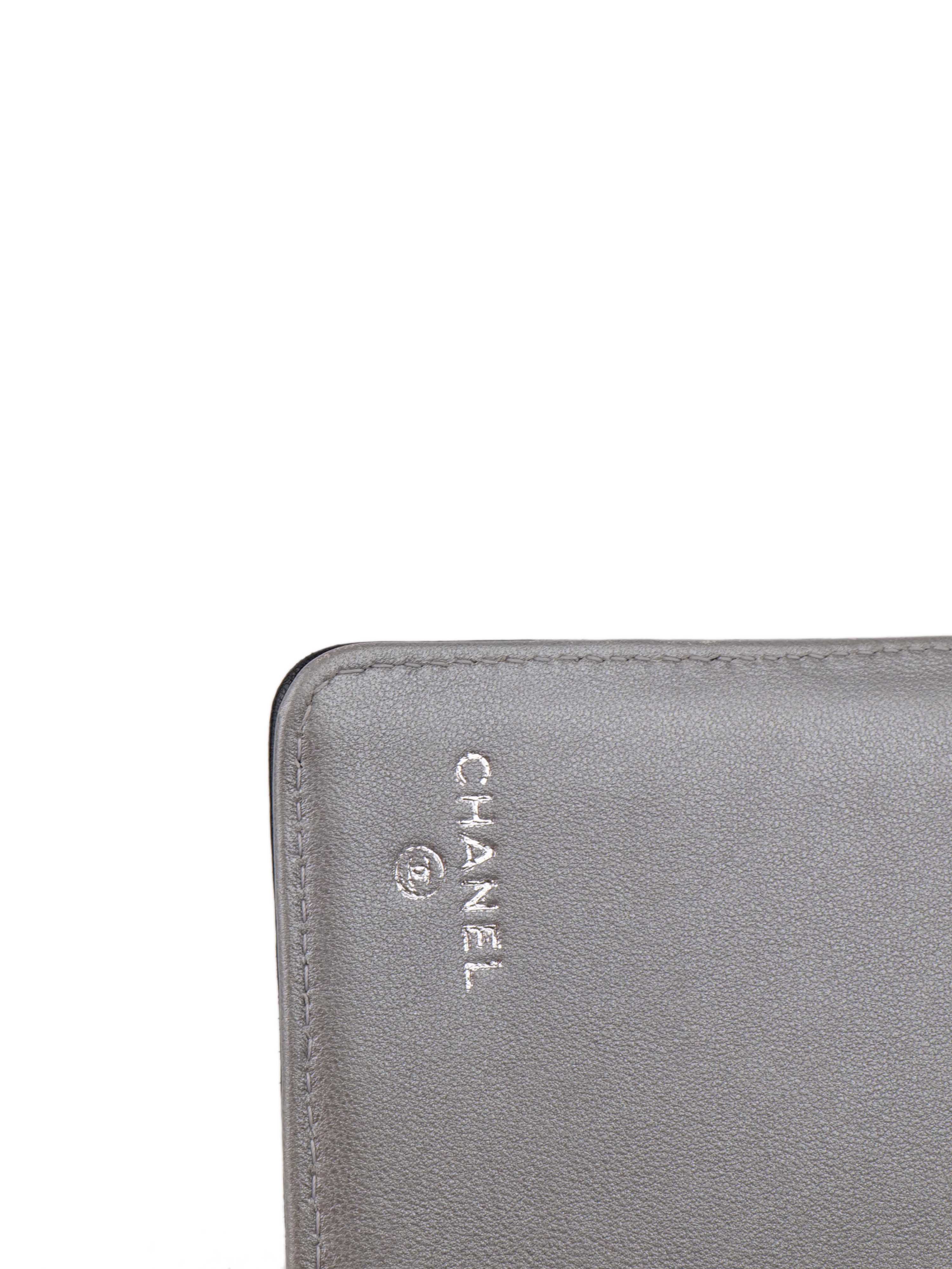Chanel Black Camellia Wallet.