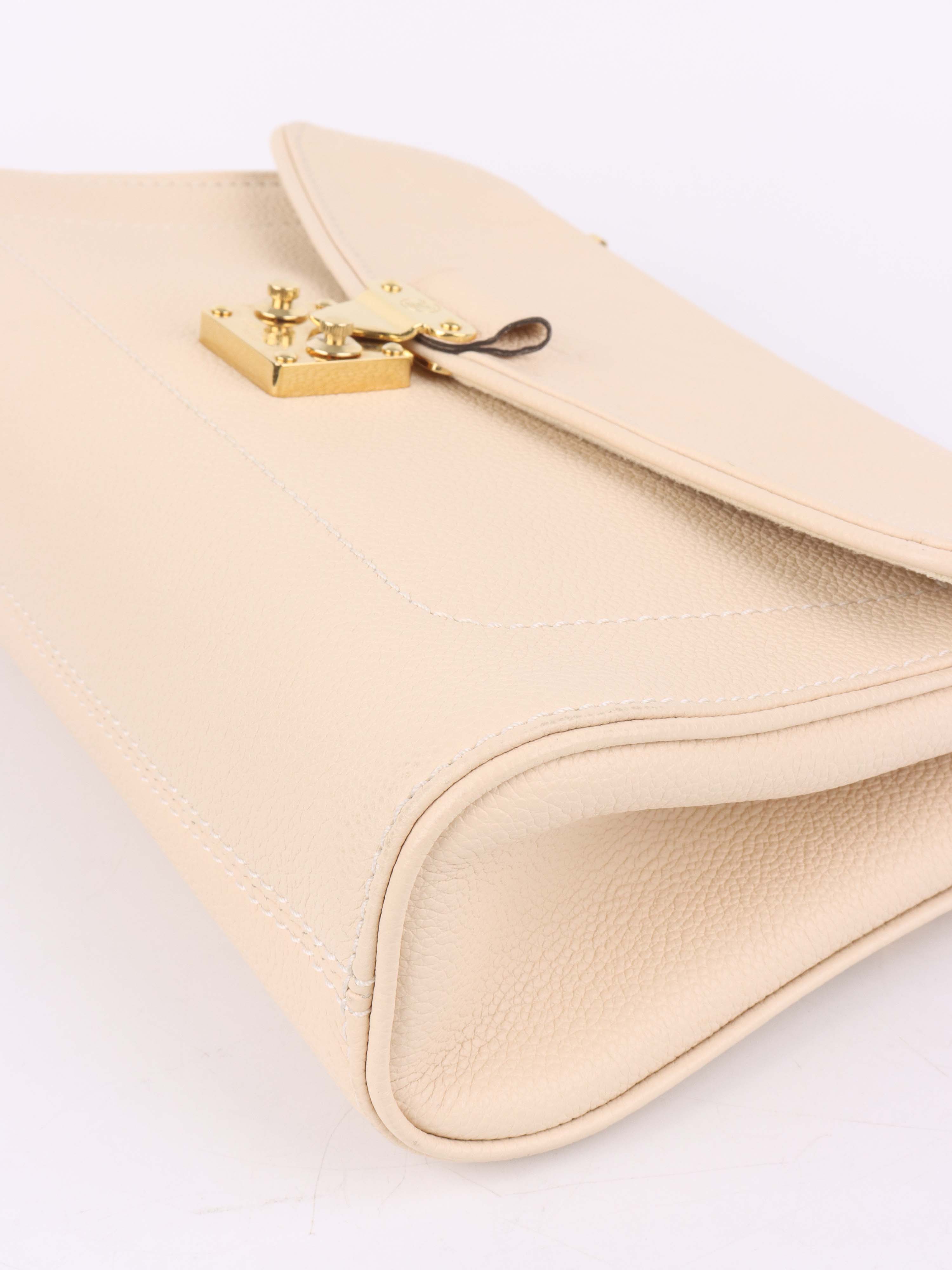 Louis Vuitton Cream Monogram Empreinte Saint Germain PM Bag.