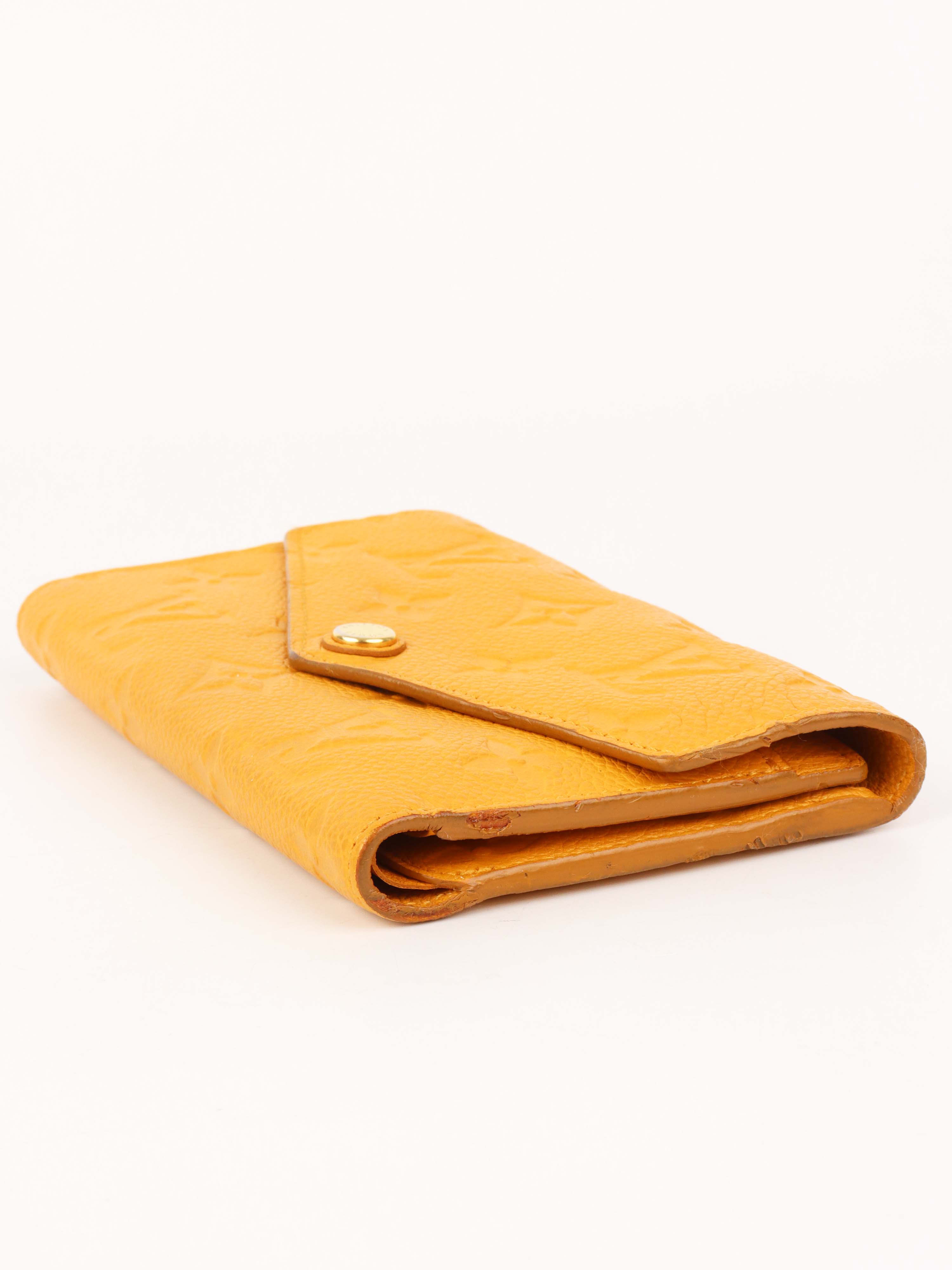Louis Vuitton Saffran Empreinte Leather Compact Wallet.
