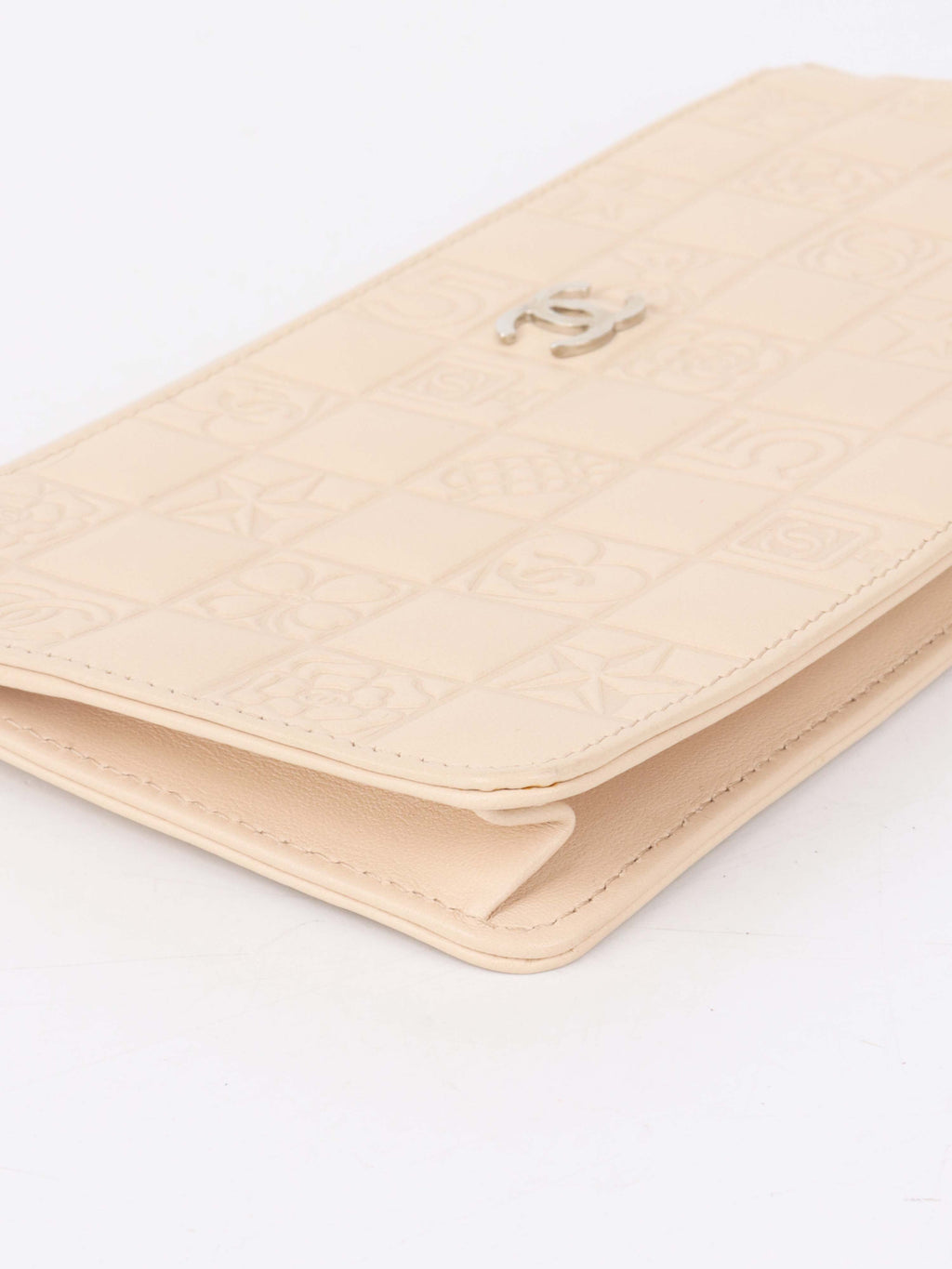 Chanel Beige Lucky Embossed Symbols Pochette with Wristlet Chain.