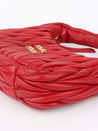 Miu Miu Small Red Wander Matelassé Bag.