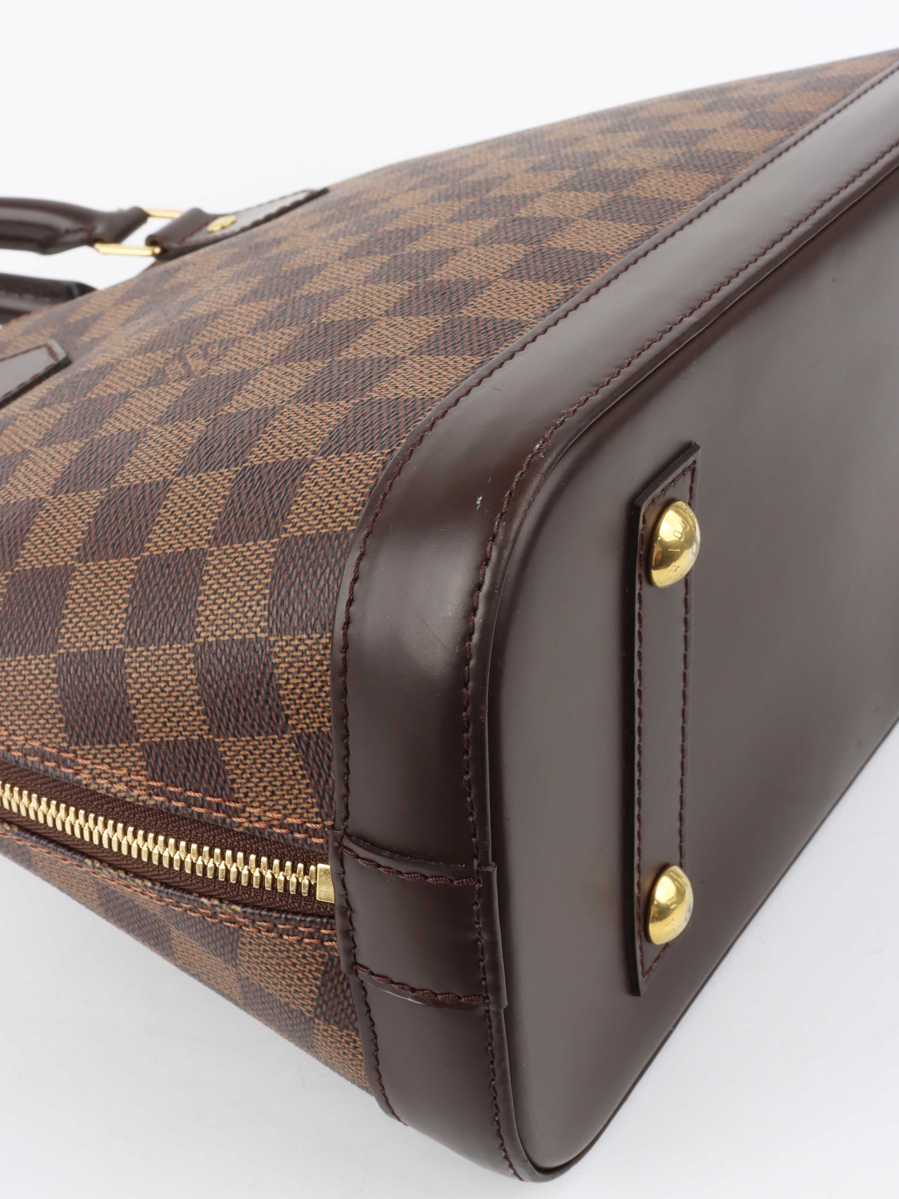 Louis Vuitton Damier Ebene Alma PM.