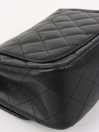 Chanel Black Mini Caviar Square Flap Bag.
