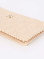 Chanel Beige Lucky Embossed Symbols Pochette with Wristlet Chain.